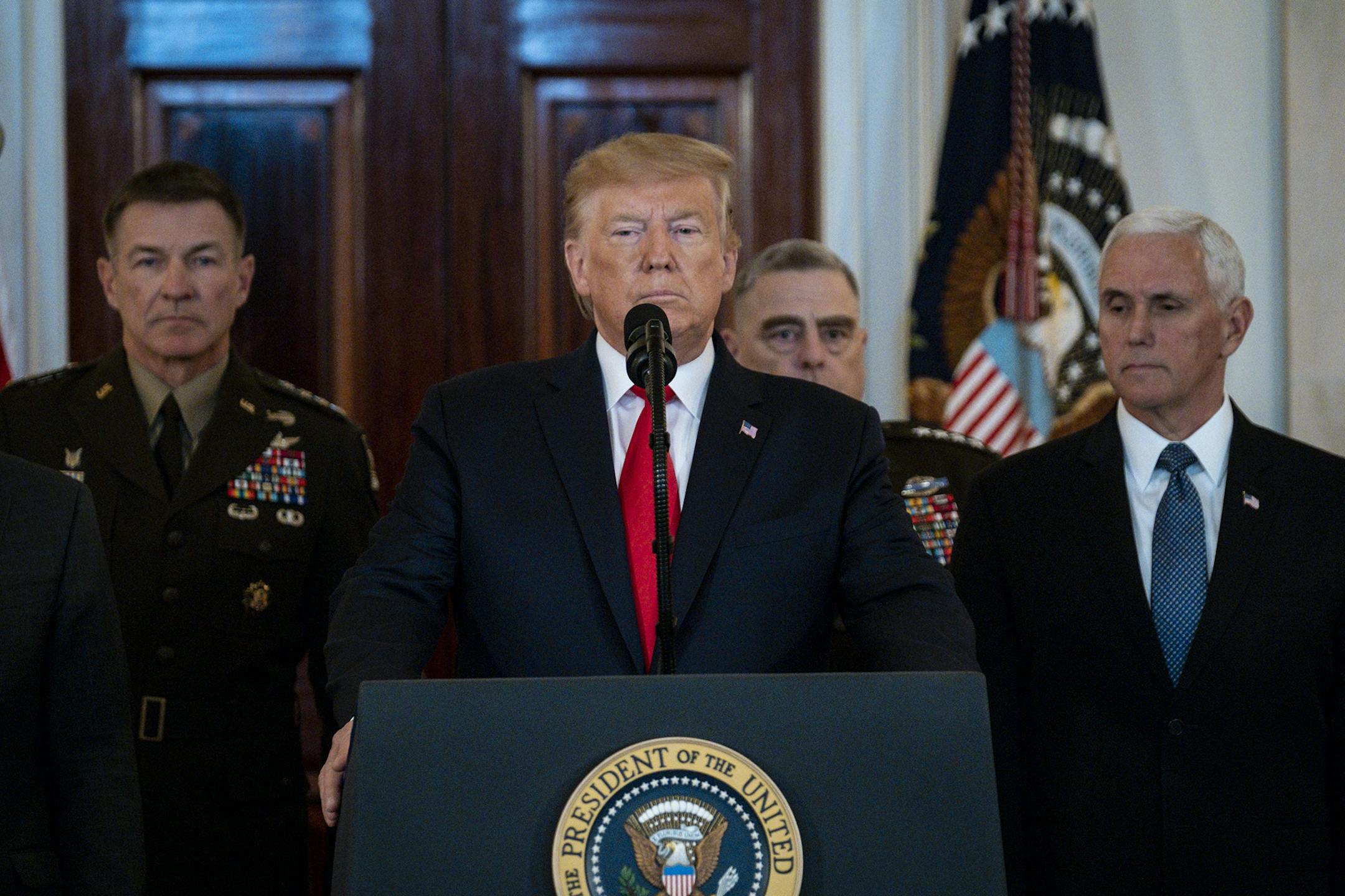 Surrounded by Secretary of Defense Mark Esper, Vice President Mike Pence and Secretary of State Mike Pompeo, as well as the Joint Chiefs of Staff, President Donald Trump delivers a statement in the Grand Foyer of the White House in response to Iran firing more than a dozen ballistic missiles at two Iraqi military bases housing U.S. troops, on January 8, 2020, in Washington, D.C. (Pete Marovich/Abaca Press/TNS) ORG XMIT: 1539078