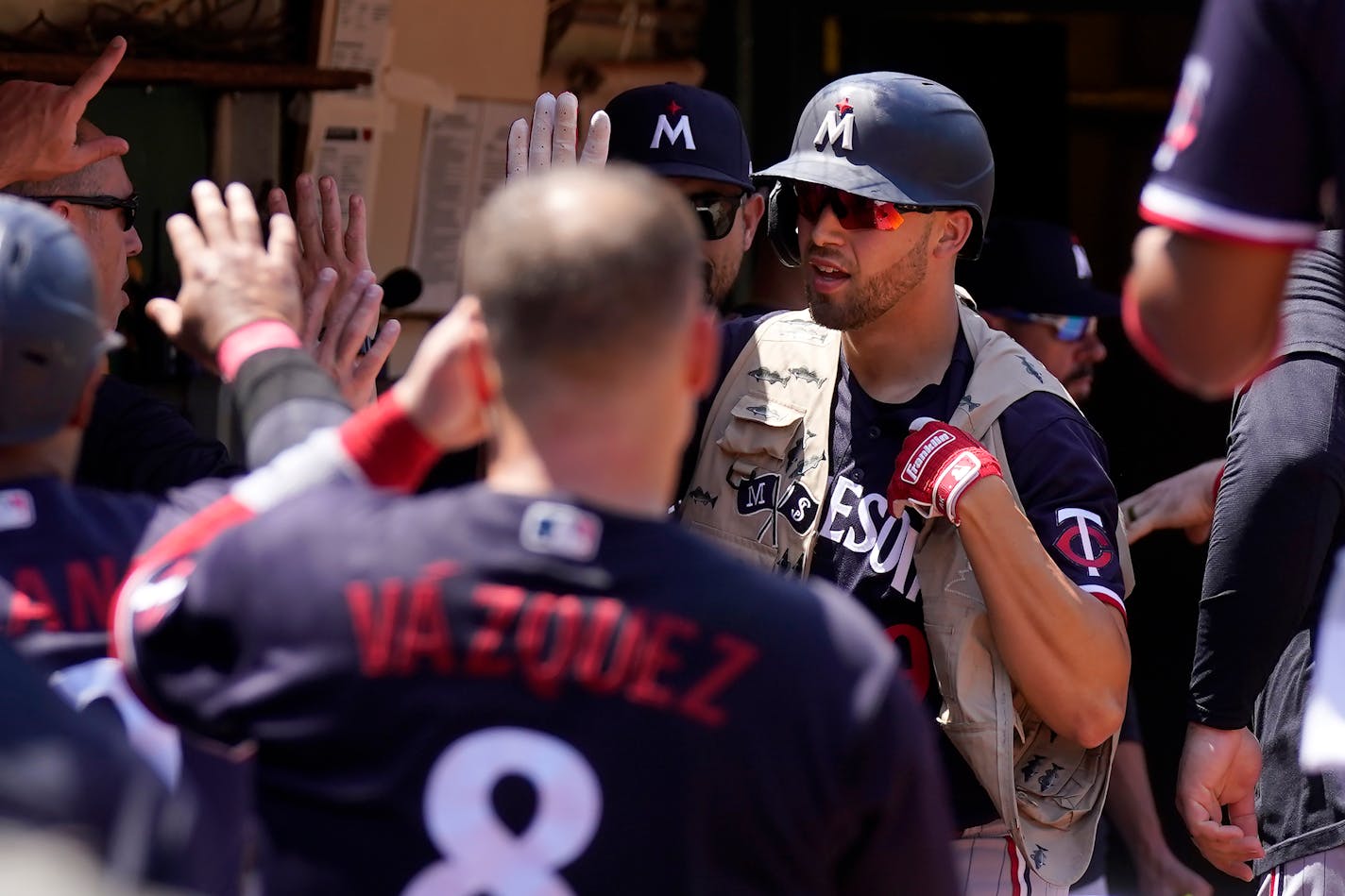 Minnesota Twins' Alex Kirilloff, middle right, is congratulated by teammates after hitting a home run during the fifth inning of a baseball game against the Oakland Athletics in Oakland, Calif., Sunday, July 16, 2023. (AP Photo/Jeff Chiu)