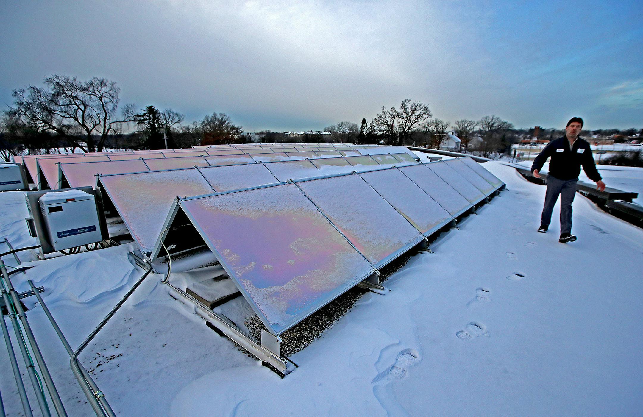 Terry Klapperick, the HVAC specialist for the City of Edina, showed how the new solar panels function on top of the Edina City Hall building, Friday, January 13, 2017 in Edina, MN. ] (ELIZABETH FLORES/STAR TRIBUNE) ELIZABETH FLORES • eflores@startribune.com ORG XMIT: MIN1701131013503406
