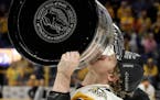 Jake Guentzel skated with the Stanley Cup soon after the Penguins won the NHL championship.