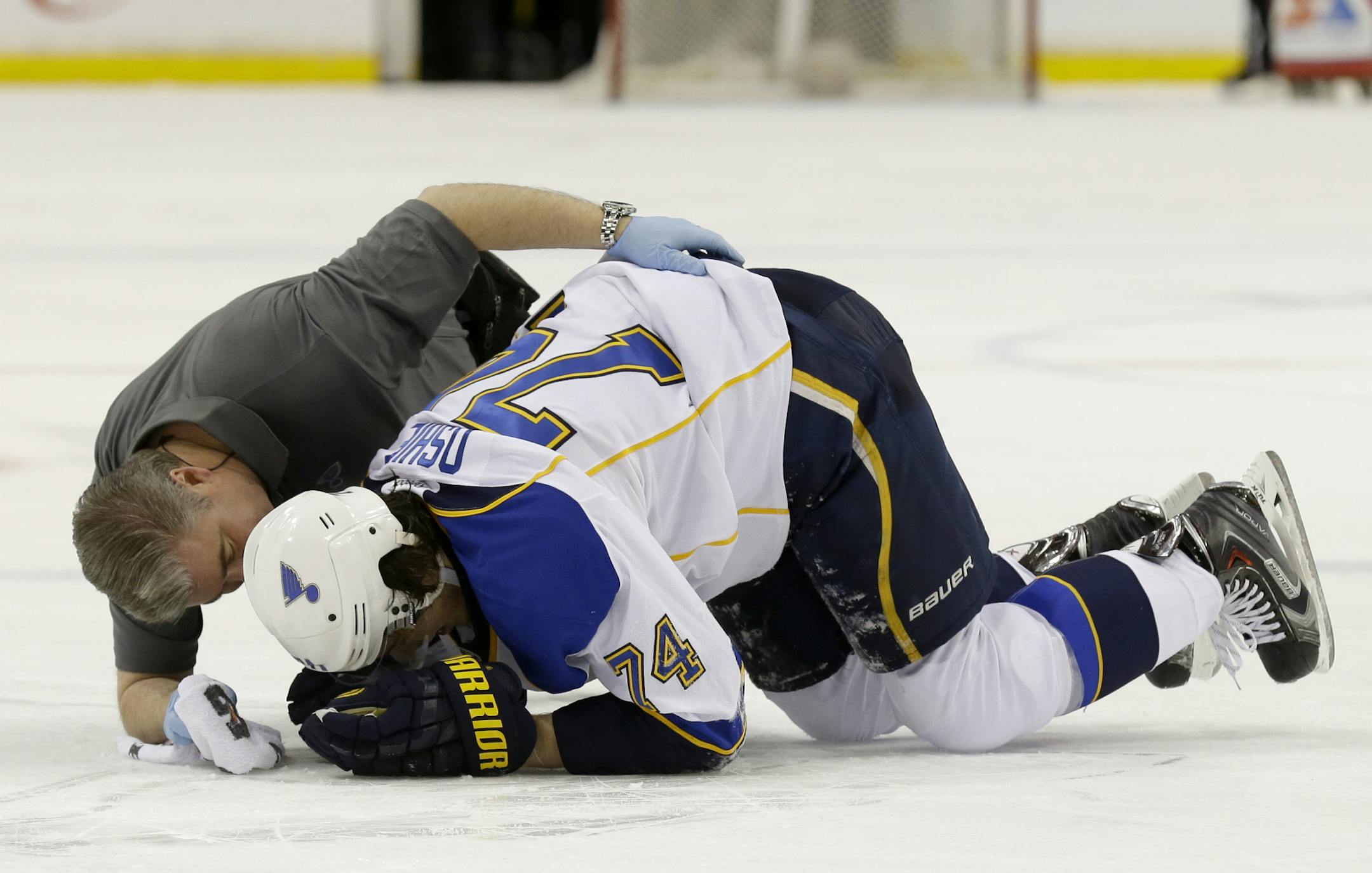St. Louis Blues right wing T.J. Oshie (74) tries to get up after being injured during the second period of an NHL hockey game against the Minnesota Wild in St. Paul, Minn., Thursday, April 10, 2014. (AP Photo/Ann Heisenfelt)