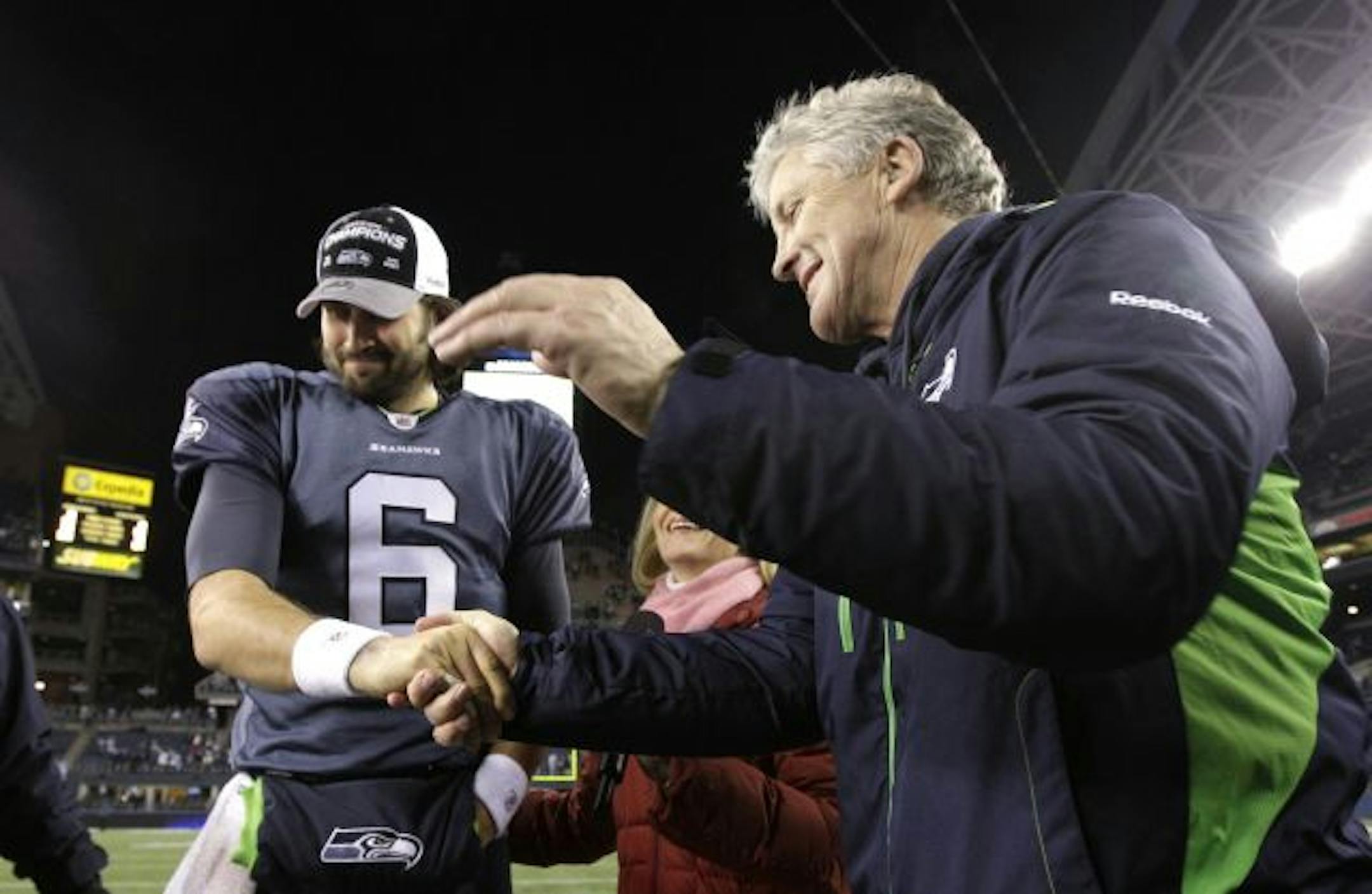 Seattle Seahawks coach Pete Carroll shook hands with quarterback Charlie Whitehurst after the victory Sunday.