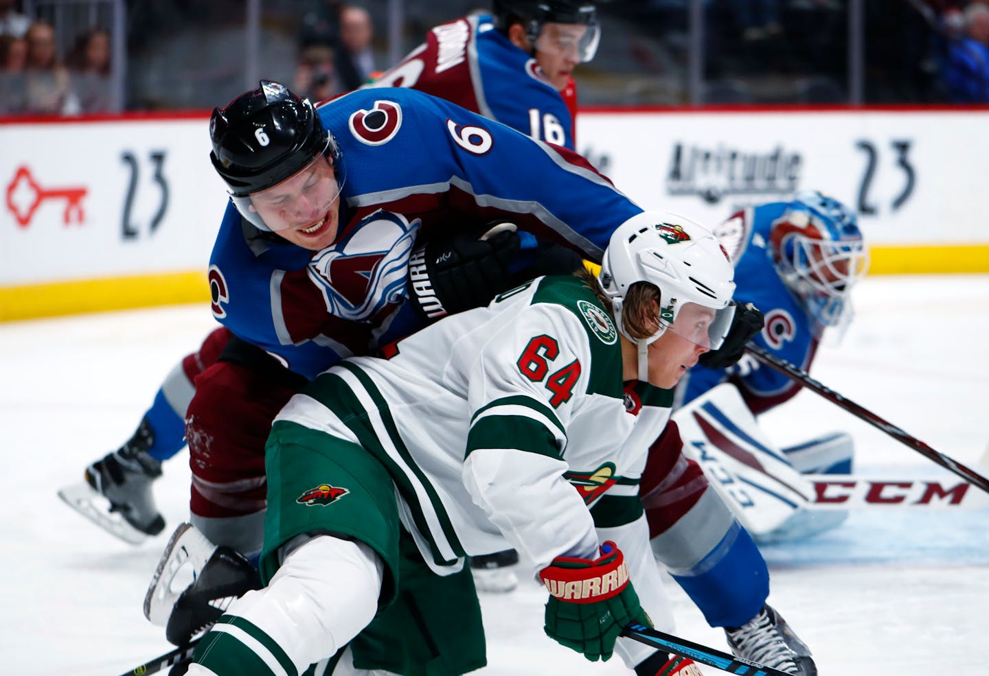 Colorado Avalanche defenseman Erik Johnson, top, falls onto Minnesota Wild right wing Mikael Granlund, of Finland, during the second period of an NHL hockey game Saturday, Jan. 6, 2018, in Denver. (AP Photo/David Zalubowski)