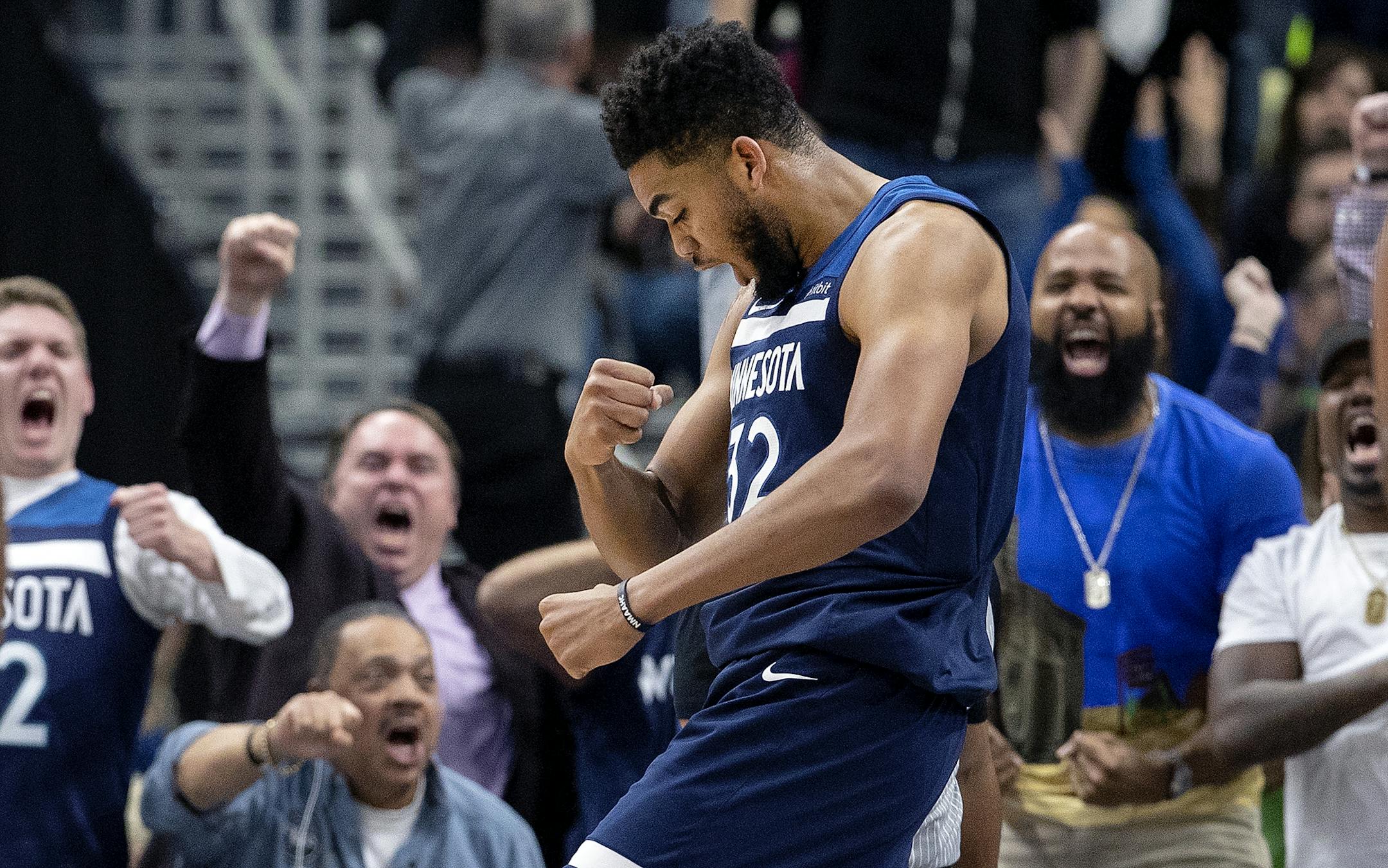 Minnesota Timberwolves Karl-Anthony Towns (32) reacted after scoring in the third quarter.