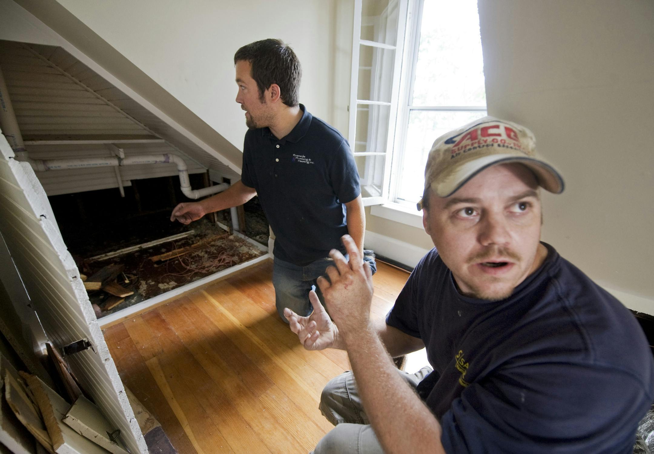DAVID BREWSTER • dbrewster@startribune.com Thursday 09/10/10 Minneapolis Mary Shanesy moved into her new Minneapolis home last week and got right to putting in central air. Workers found quite the surprise when they opened up a knee wall on the 3rd floor for duct work: 40 bottles and four more full cases of liquor that appear to have been stashed since Prohibition. ] Trevor Ogilvie, from Blue Construction, and Mike Sullivan, with Sayler Heating and Air, talked about the day they stumbled