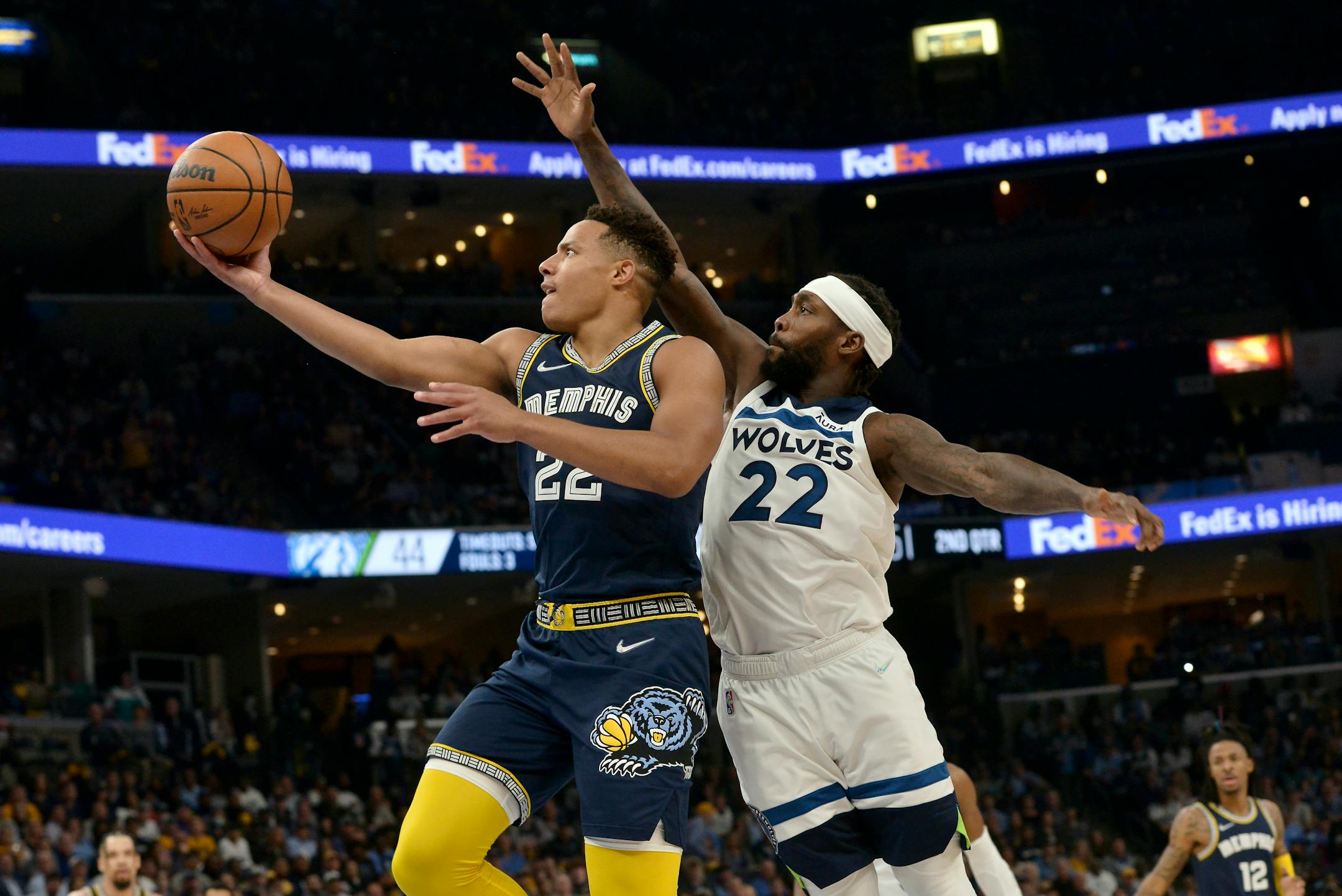Memphis Grizzlies guard Desmond Bane shoots against Minnesota Timberwolves guard Patrick Beverley during the first half during Game 2 of a first-round NBA basketball playoff series Tuesday, April 19, 2022, in Memphis, Tenn. (AP Photo/Brandon Dill)