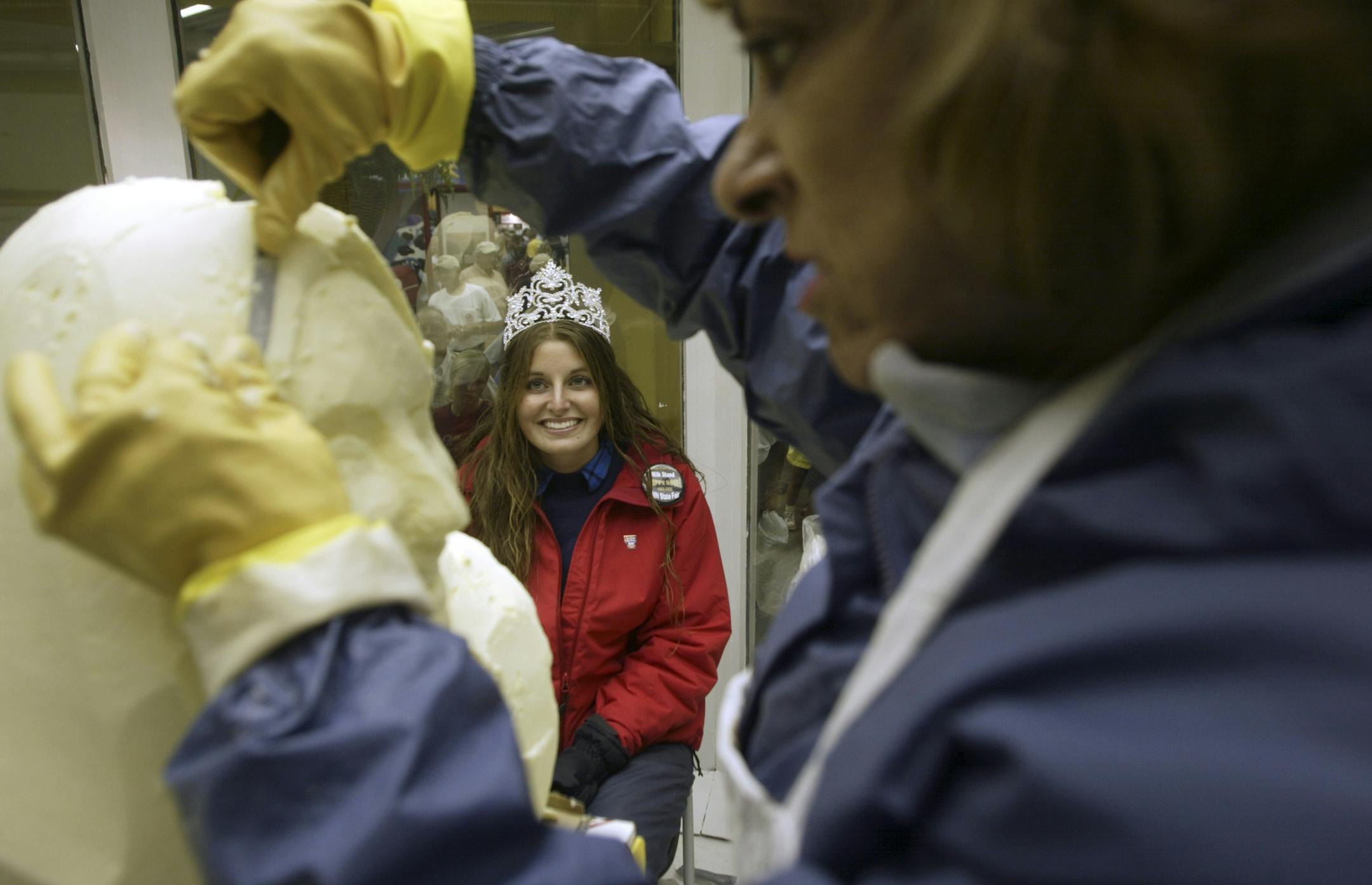 Jeanna Duerscherl / Star Tribune St. Paul 08/25/05 The 2005 Princess Kay, Rebekah Dammann of Lester Prairie, sits in a 38 degree cooler while Linda Christensen carves her into a 90 pound block of butter. Christensen has been creating the sculptures for 33 years and the process takes from 6 - 8 hours. Dammann is planning on having her sculpture on display in a store in her hometown. GENERAL INFORMATION: Butter carving of 2005 Princess Kay