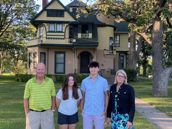 The Jones family — Tom, Alexis, Spencer and Nancy — in front of their Queen Anne home in Albert Lea, built in 1887 by ancestor Albert Clark Wedge