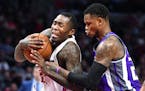 The Los Angeles Clippers' Jamal Crawford, left, drives against the Sacramento Kings' Ben McLemore at Staples Center in Los Angeles on Wednesday, April