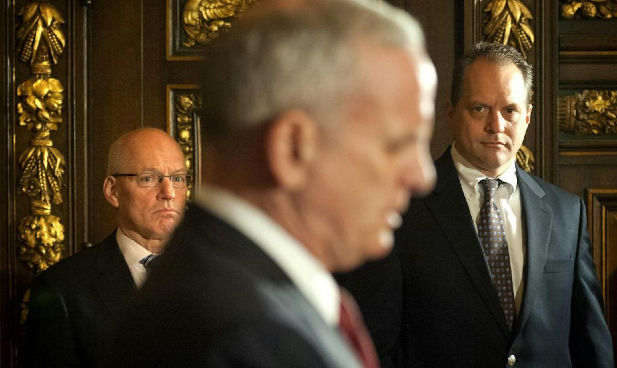 Revenue Commissioner Myron Frans, left, and Management and Budget Commissioner Jim Showalter joined governor Dayton as he announced his veto of the tax bill Friday, May 4, 2012.