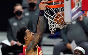 Atlanta Hawks forward John Collins dunks during the first half of an NBA basketball game against the Los Angeles Clippers on Monday.
