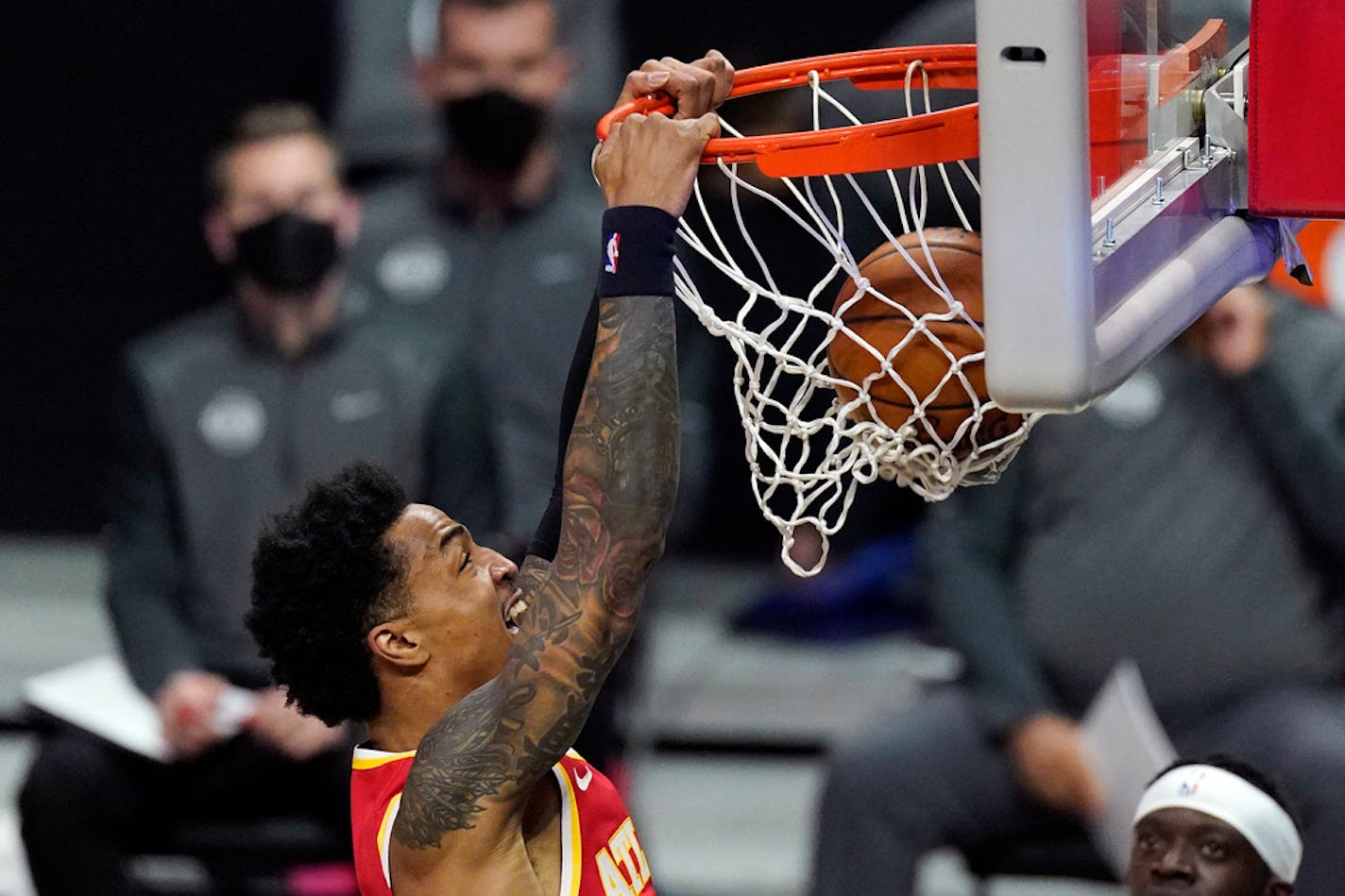 Atlanta Hawks forward John Collins dunks during the first half of an NBA basketball game against the Los Angeles Clippers on Monday.