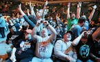Timberwolves fans Rachael Eggert left and her husband Todd Dombrock cheered after Minnesota was award the first pick in the NBA draft during draft lot