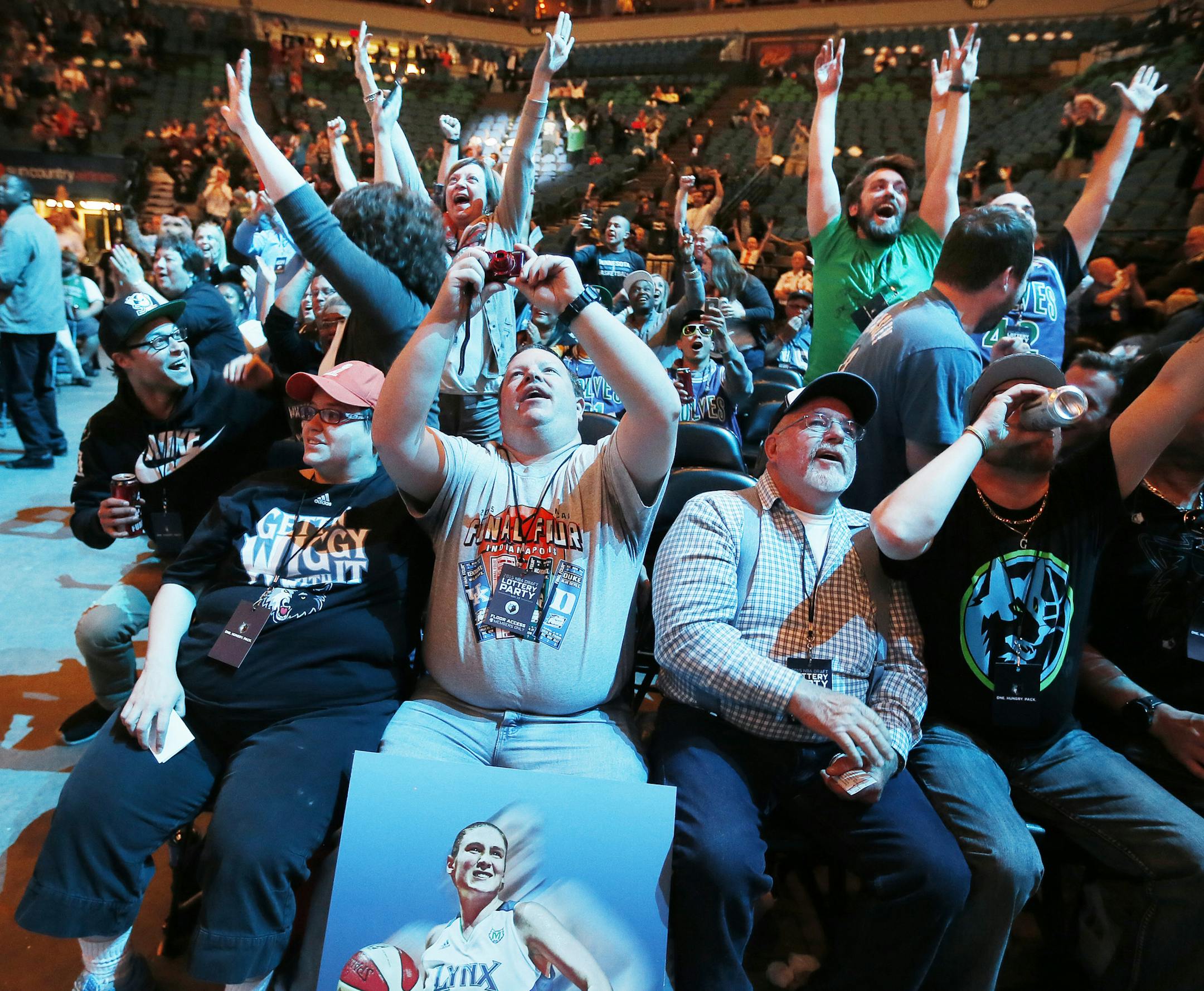 Timberwolves fans Rachael Eggert left and her husband Todd Dombrock cheered after Minnesota was award the first pick in the NBA draft during draft lottery pick party at Target Center Tuesday May 19, 2015 in Minneapolis, MN. ] Jerry Holt/
