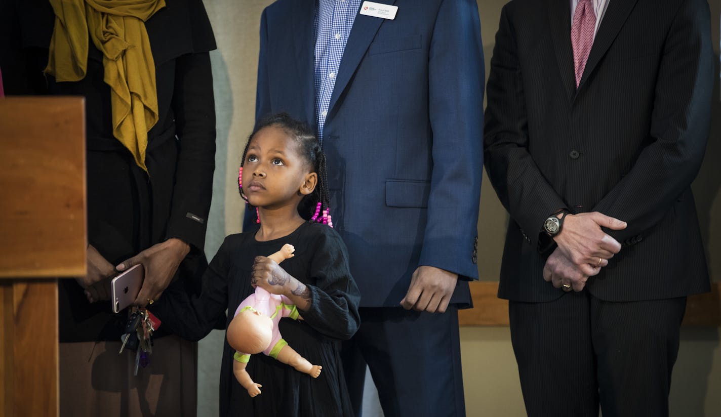 Mushkaad Abdi, 4, stood holding hands with her mother Samira Dahir at a press conference at Lutheran Social Services in Minneapolis, Minn., on Friday, February 3, 2017. ] RENEE JONES SCHNEIDER &#x2022; renee.jones@startribune.com