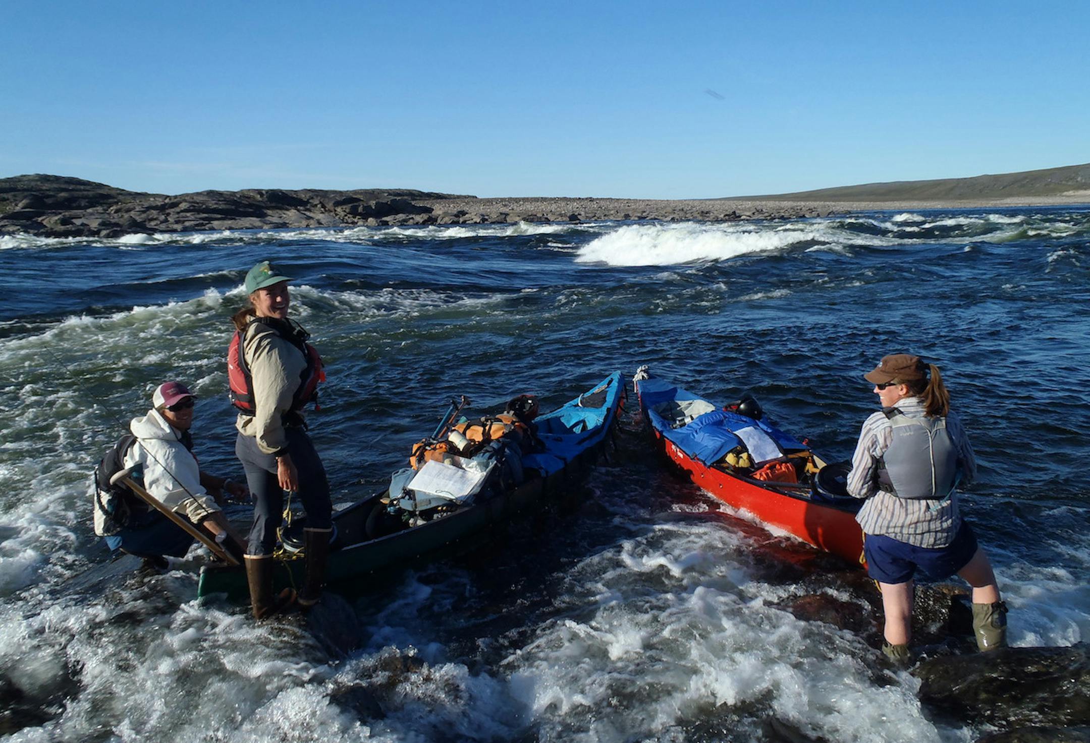 Nat Shepard, left, Emily Myhre, center, and Susan Amis are shown last summer downstream from the confluence of the Meadowbank River, about 85 miles from the Arctic Ocean.