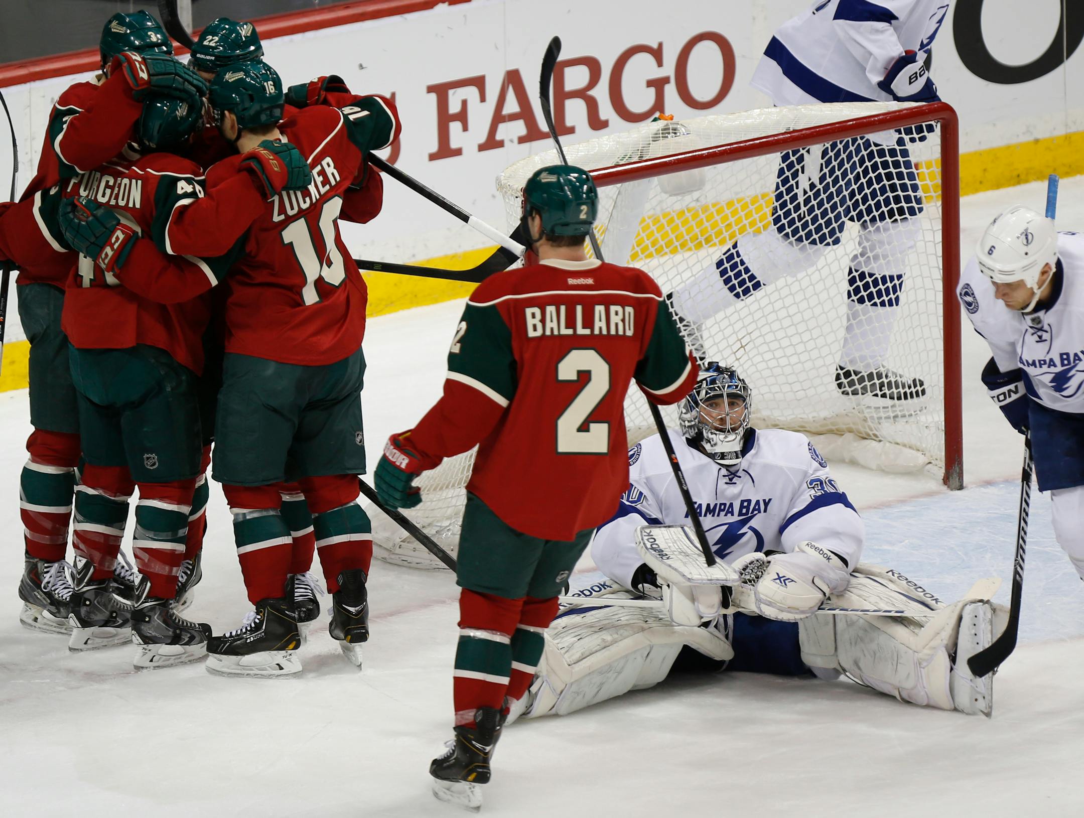 At the Xcel Energy Center in a game between Tampa Bay and the Wild, the Wild celebrate Nino Niederreiter's goal as goalie Ben Bishop(30) sits dejected.