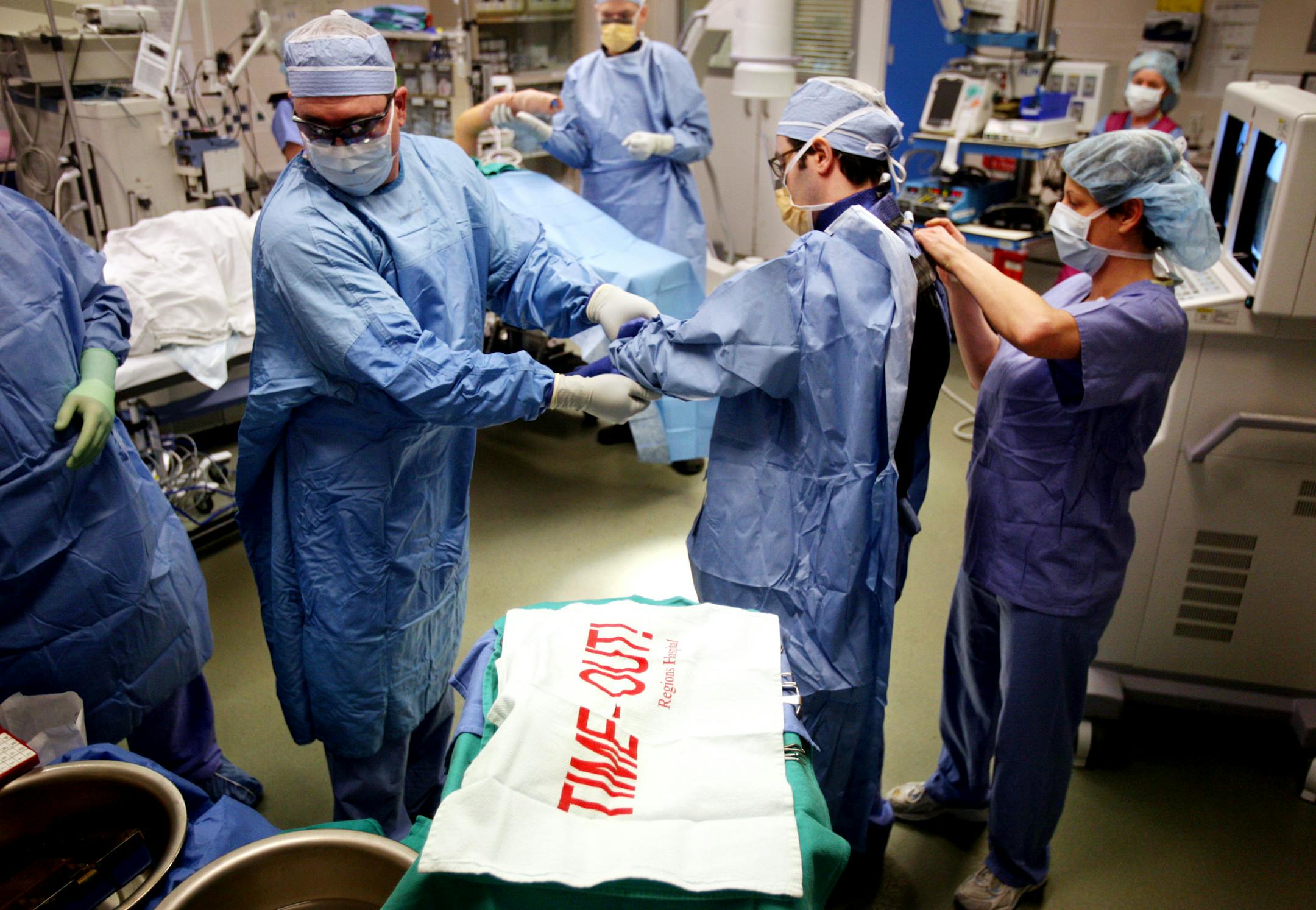 With a "time-out towel" covering instruments, medical personnel prepare for surgery at Regions Hospital in St. Paul Tuesday, January 6, 2009. The "time-out towel" was implemented early last year at Regions to remind the operating-room team to review and double check their procedure.