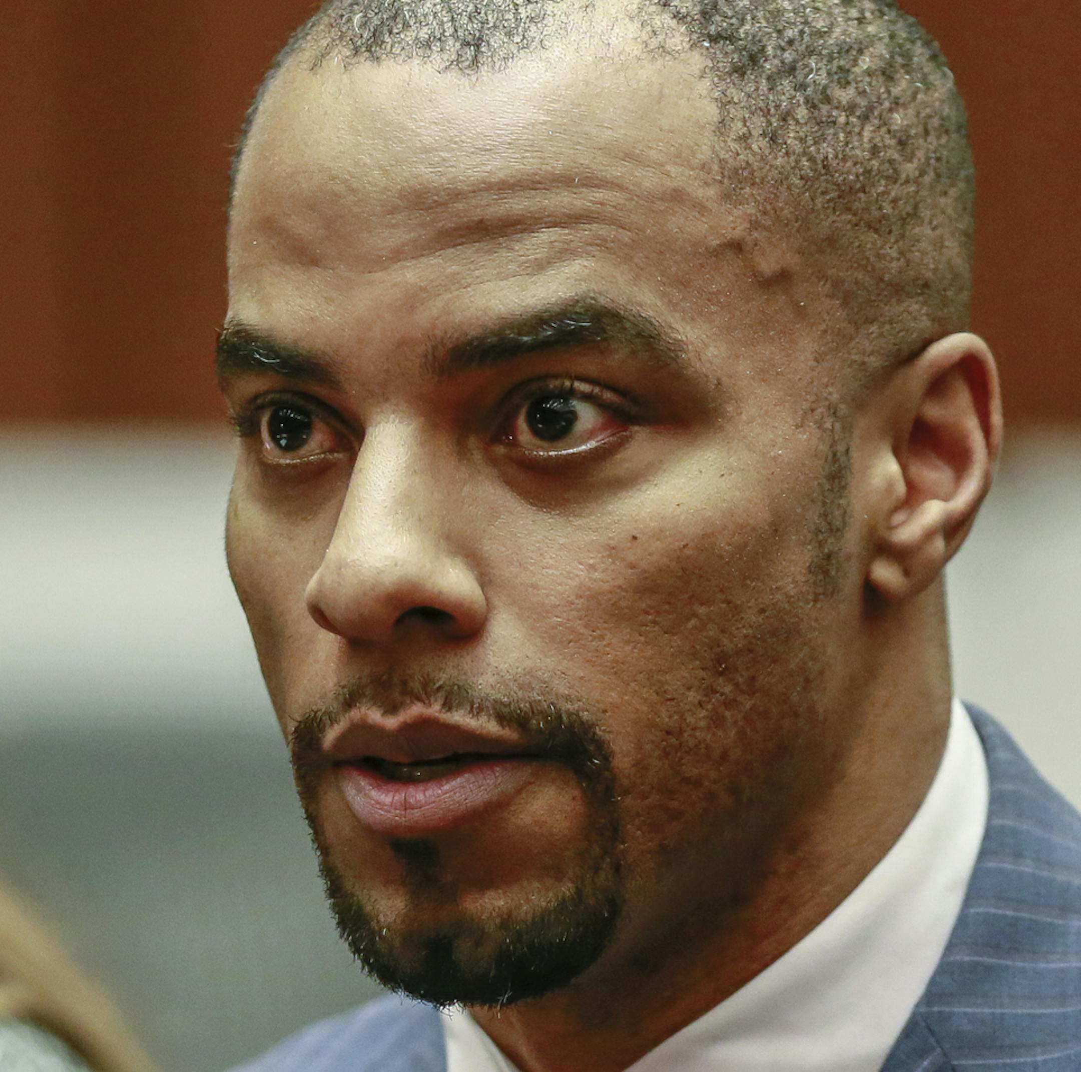 FILE - In this March 23, 2015, file photo, former NFL safety Darren Sharper, center, is flanked by his attorneys, Lisa Wayne, left, and Leonard Levine, right, in Los Angeles Superior Court. The sentencing of former New Orleans Saints player Darren Sharper on federal charges that he drugged and assaulted women in four states has been rescheduled. U.S. District Judge Jane Triche Milazzo issued an order Thursday, July 16, 2015, resetting Sharper's sentencing for Oct. 1 at the request of probation o