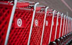 Rain drops sit on shopping carts outside a Target Corp. store in Peru, Illinois, U.S., on Thursday, Feb. 7, 2013. Target Corp. led U.S. retailers to t