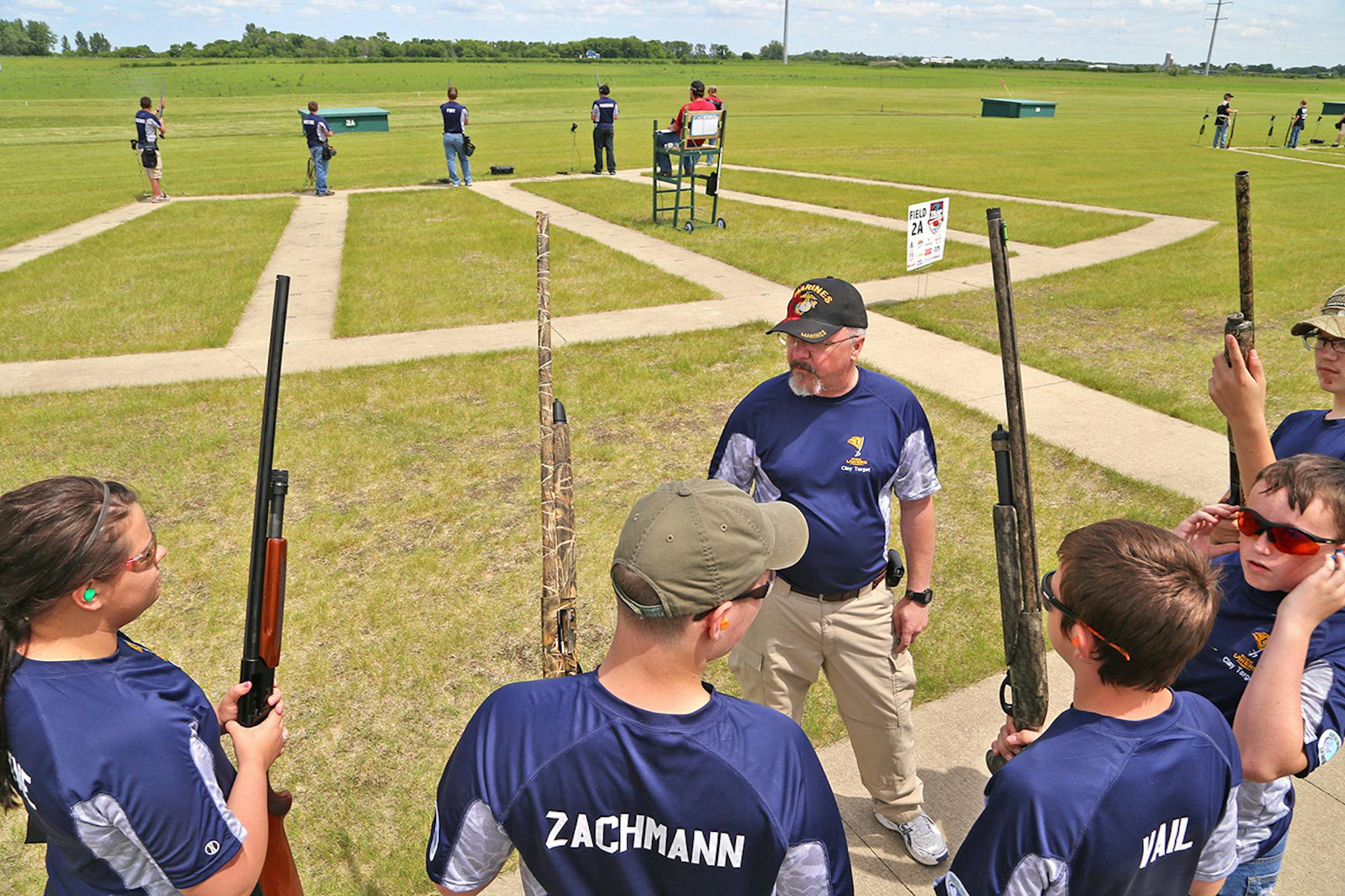 Pep talk: A coach of the Howard Lake-Waverly-Winstead trapshooting team gave final instructions before his squad shot trap on Thursday in Alexandria.