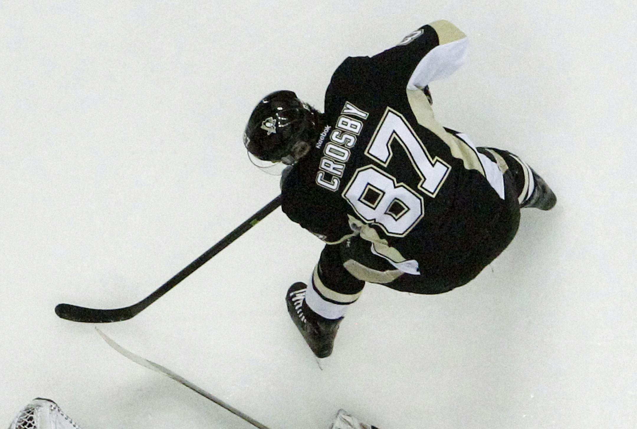 Buffalo Sabres goalie Ryan Miller (30) makes the save on a shot by Pittsburgh Penguins' Sidney Crosby (87) in the second period of an NHL hockey game in Pittsburgh, Monday, Jan. 27, 2014. The Penguins won 3-0. (AP Photo/Gene J. Puskar)