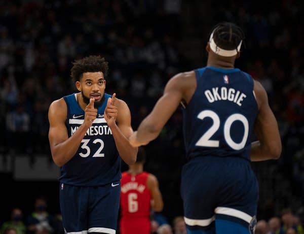 Karl-Anthony Towns (32) pointed to Josh Okogie (20) after he made a defensive play in the fourth quarter Wednesday night. 