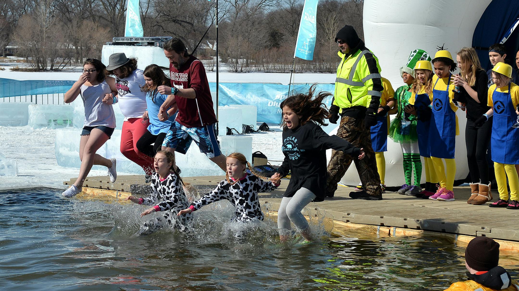 Students of South St. Paul's Lincoln Center fundraising team plunge into the icy waters of Lake Calhoun. ] (SPECIAL TO THE STAR TRIBUNE/BRE McGEE)