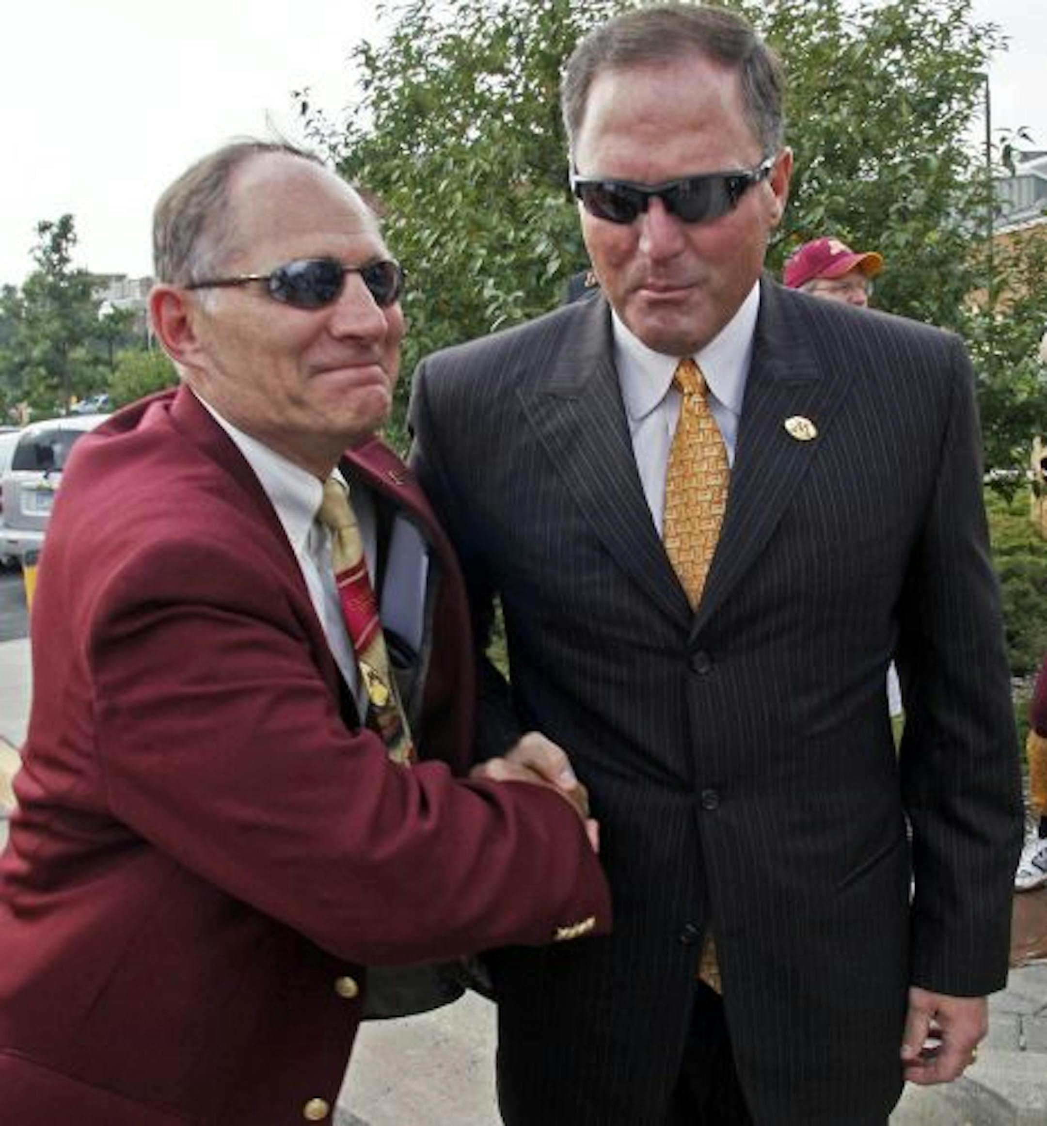 Joel Maturi, Tim Brewster