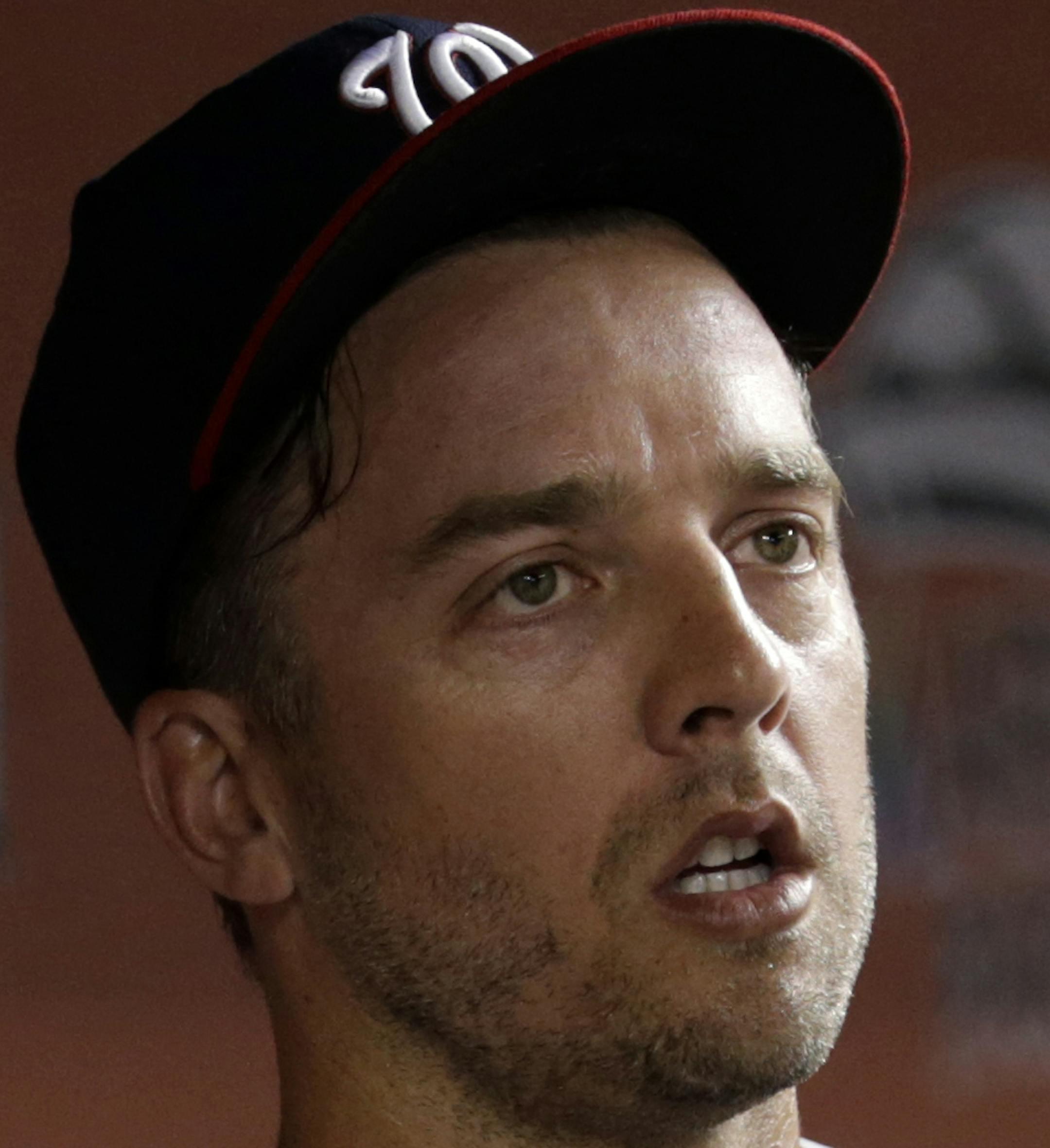 Washington Nationals relief pitcher Brandon Kintzler stands in the dugout after pitching during the seventh inning of a baseball game against the Miami Marlins, Wednesday, Aug. 2, 2017, in Miami. The Marlins won 7-0. (AP Photo/Lynne Sladky) ORG XMIT: OTK