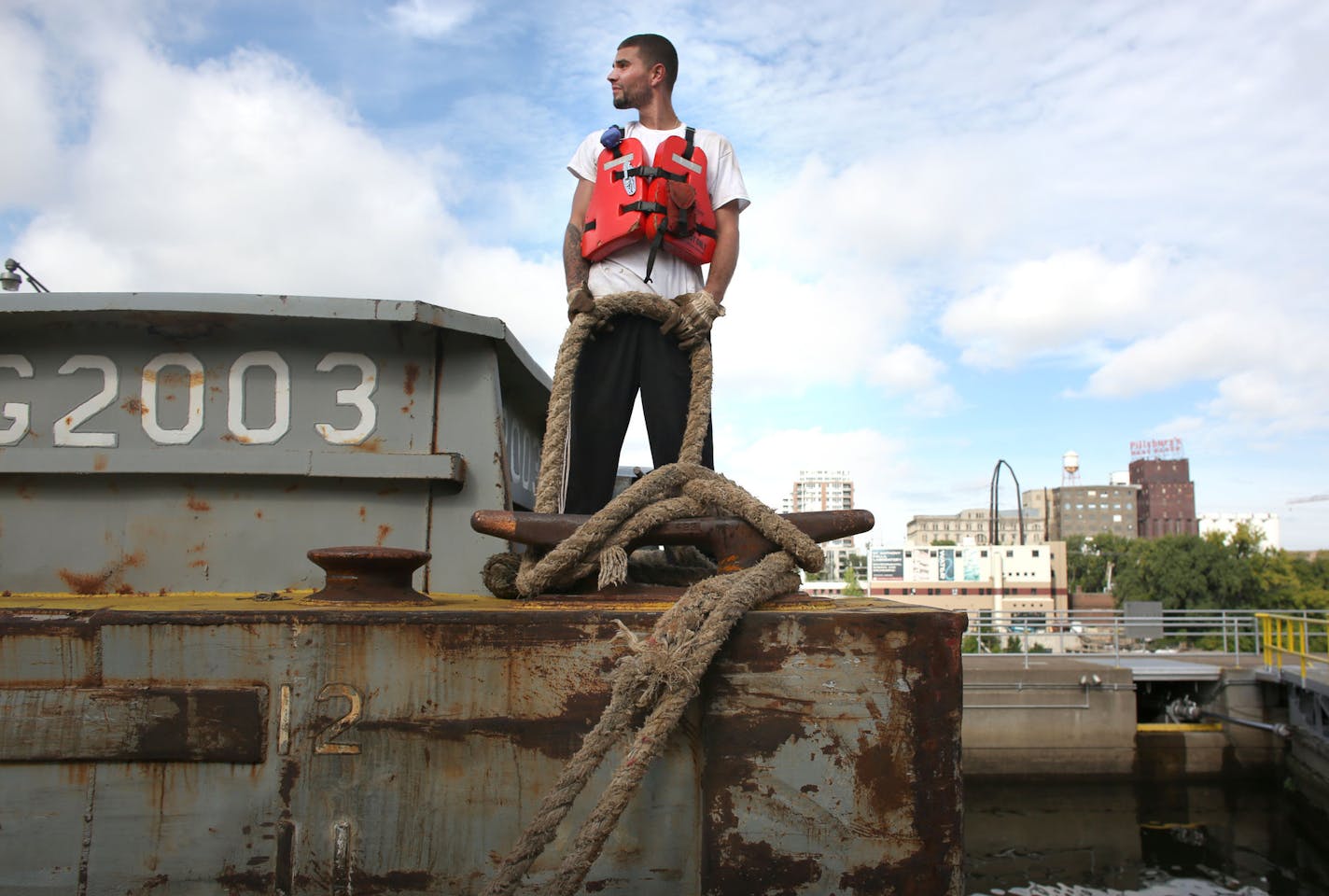 Justin Poole looked back at the tug boat as they wait for the water to go down as they prepared to go through the St. Anthony Falls Lock and Dam in Minneapolis Wednesday September 19, 2013. ] (KYNDELL HARKNESS/STAR TRIBUNE) kyndell.harkness@startribune.com