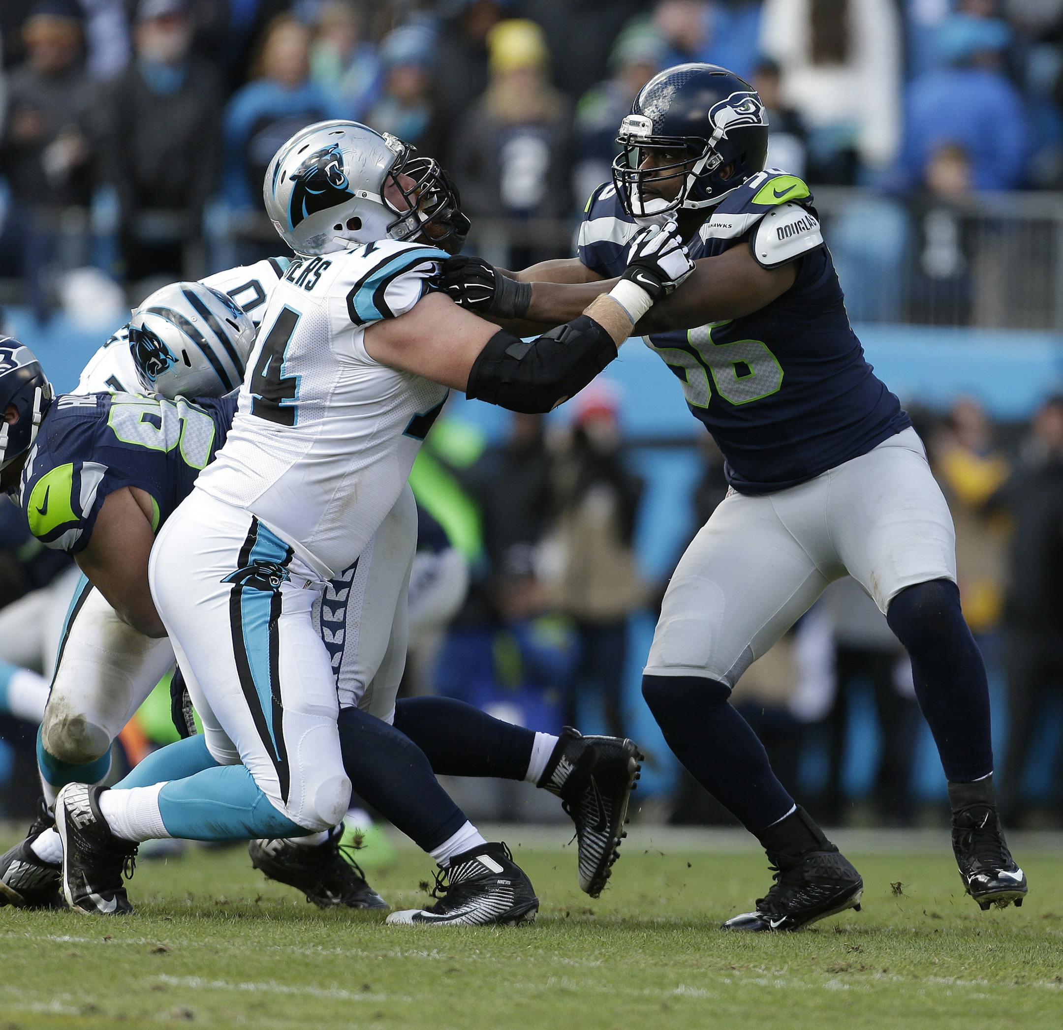 Seattle Seahawks defensive end Cliff Avril (56) works against Carolina Panthers tackle Mike Remmers (74) during the first half of an NFL divisional playoff football game, Sunday, Jan. 17, 2016, in Charlotte, N.C. (AP Photo/Bob Leverone) ORG XMIT: NCMS1