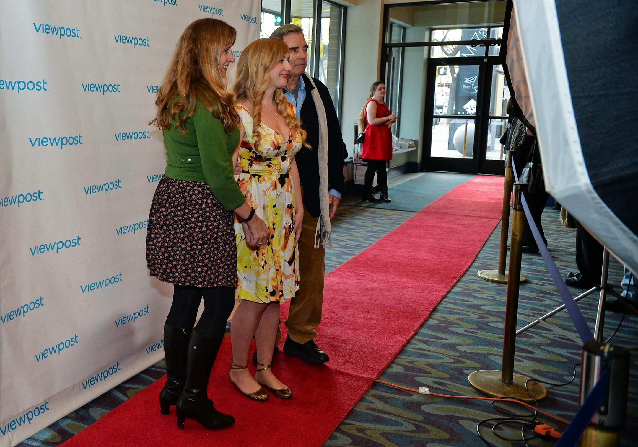 The Public Domain actor Emily Bridges (center) poses for photos on the film's red carpet premier with her parents Wendy and Beau Bridges at the Lagoon Cinema in Uptown.
