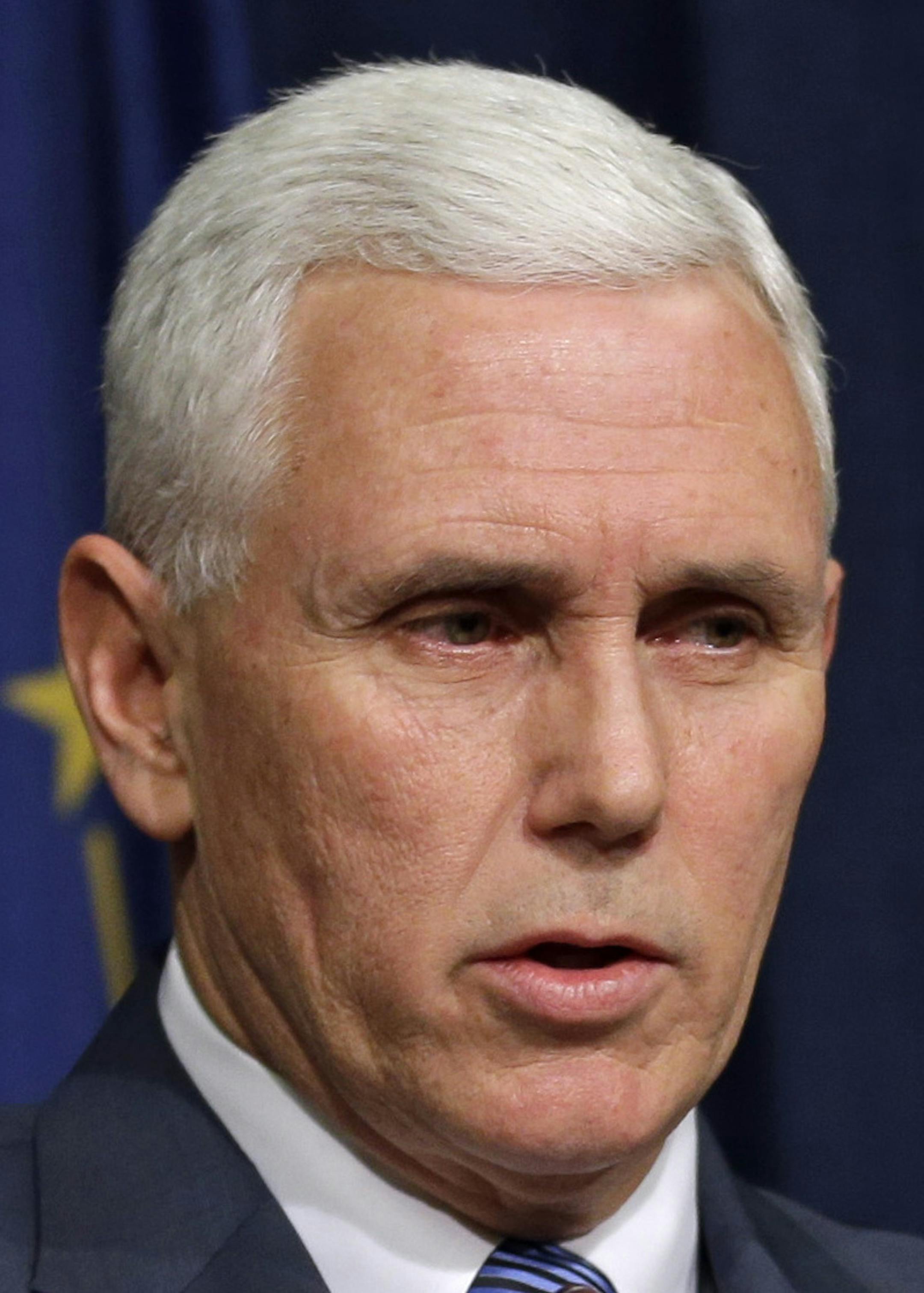 Indiana Gov. Mike Pence holds a news conference at the Statehouse in Indianapolis, Thursday, March 26, 2015. Pence has declared a public health emergency in response to the HIV epidemic in Scott County. Seventy two cases of HIV have been confirmed in the southern Indiana county. (AP Photo/Michael Conroy)