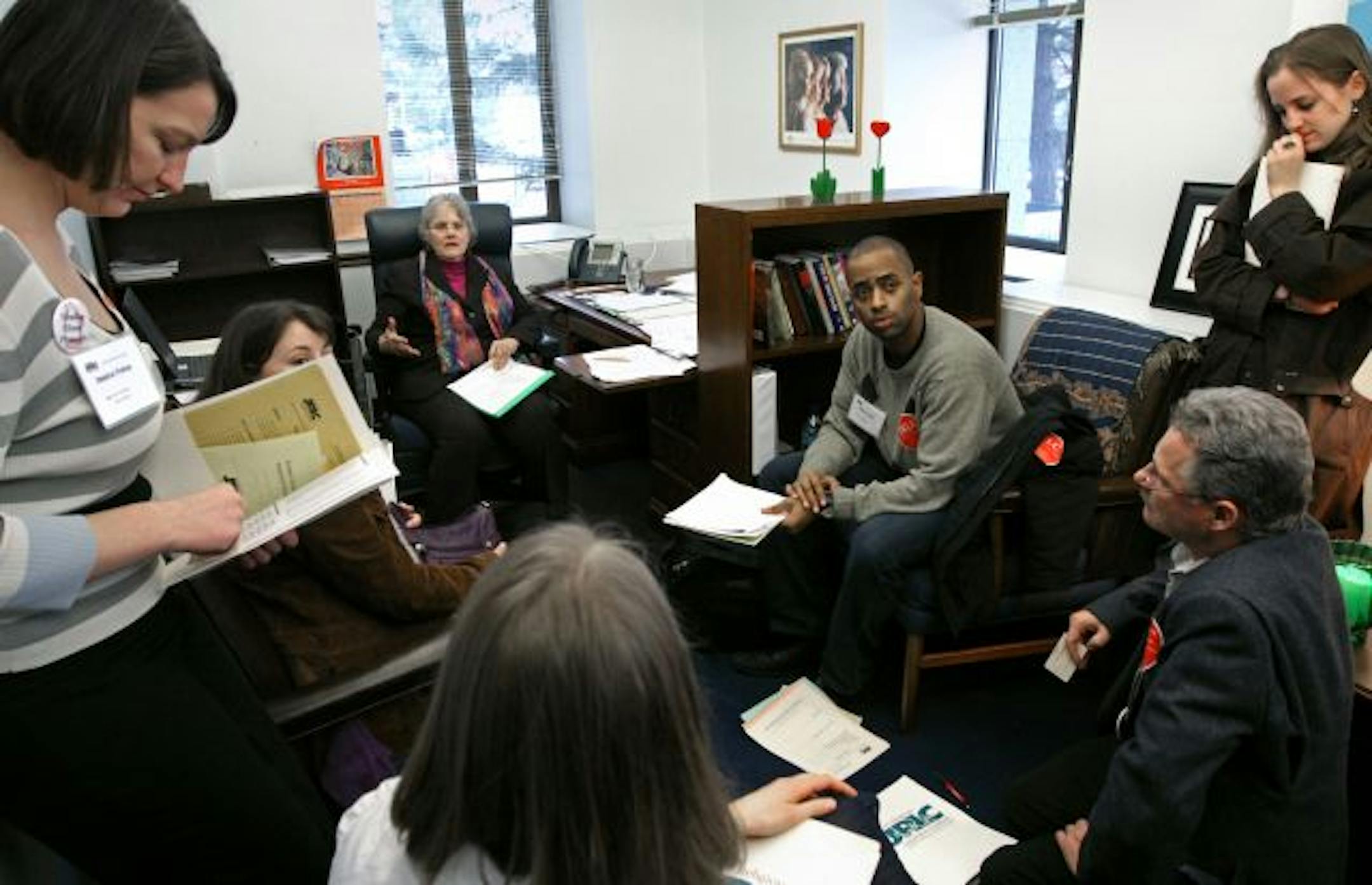 Members of the Joint Religious Legislative Coalition talked with State Sen. Linda Berglin, DFL-Minneapolis, seated in the background, about health and human services on the coalition's Day on the Hill.