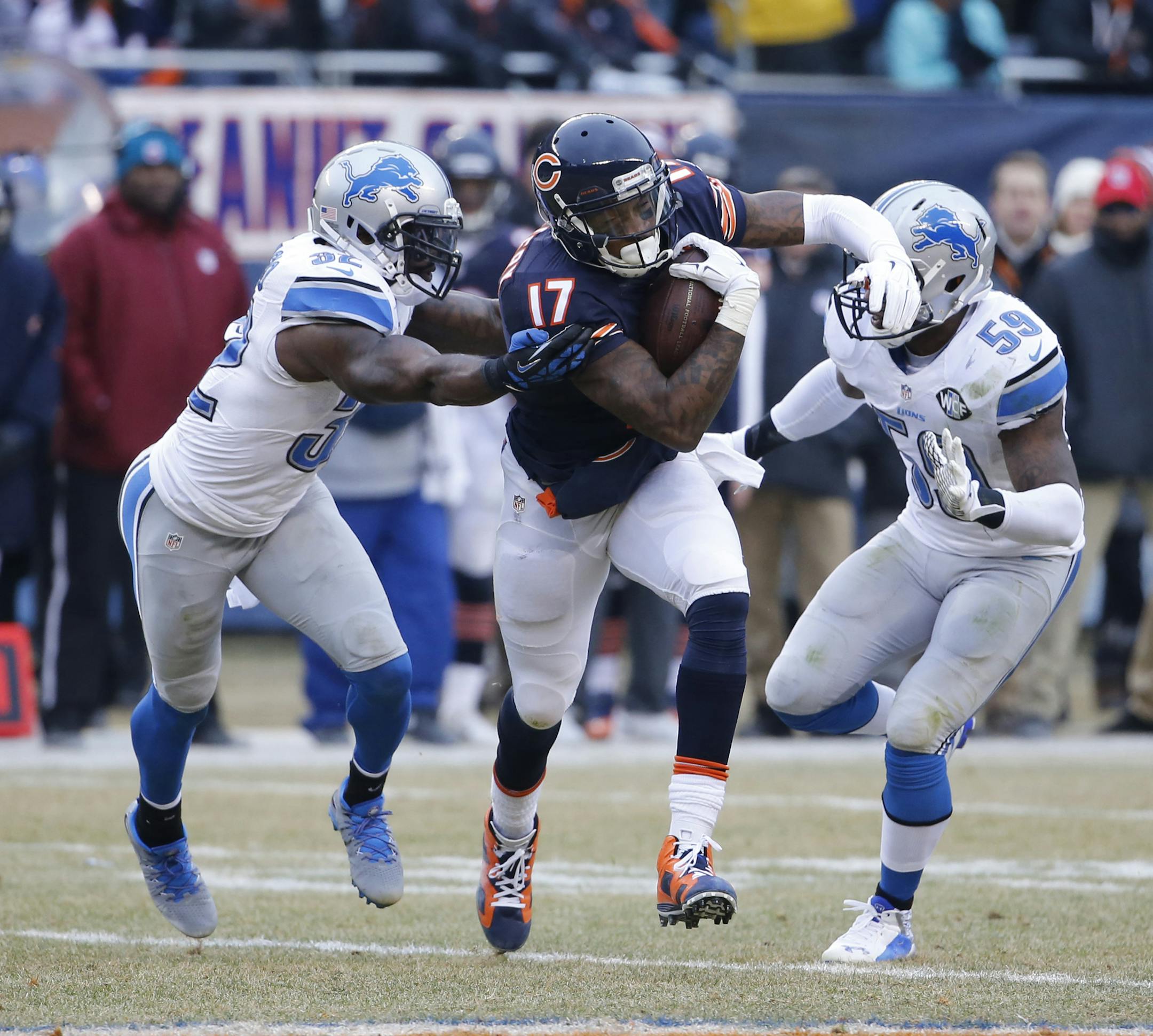Chicago Bears wide receiver Alshon Jeffery (17) carries the ball against Detroit Lions safety James Ihedigbo (32) and linebacker Tahir Whitehead (59) in the first half of an NFL football game Sunday, Dec. 21, 2014, in Chicago. (AP Photo/Charles Rex Arbogast) ORG XMIT: CXB1