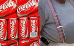 Cartons of Coca-Cola were displayed in a grocery in Des Plaines, Ill. The amount of full-calorie soda drunk by the average American has dropped 25 per