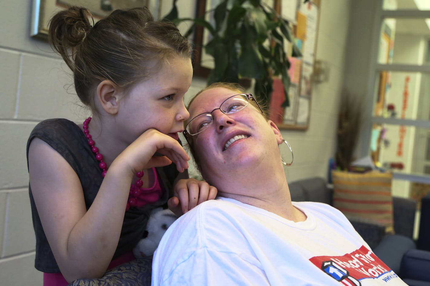 Head Start mother Shawnee Twiet, who is also the policy chair and sits on the board, and her daughter Kalia, 6, who is autistic, chatted before Shawnee helped with new parent orientation Thursday, June 13, 2013, in Minneapolis, MN. Twiet, who calls herself shy, said her children blossomed under the program and the program also helped her overcome hardships like the May 2011 tornado in north Minneapolis where they live as well as being attacked in a city park in June of 2011. Twiet calls the prog