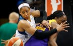 Minnesota Lynx Maya Moore (23) fought for a loose ball with Nneka Ogwumike (30) in the fourth quarter.