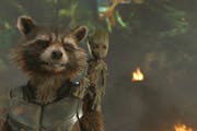 This image released by Disney shows the Rocket, voiced by Bradley Cooper, left, and Groot, voiced by Vin Diesel in a scene from Marvel's "Guardians Of