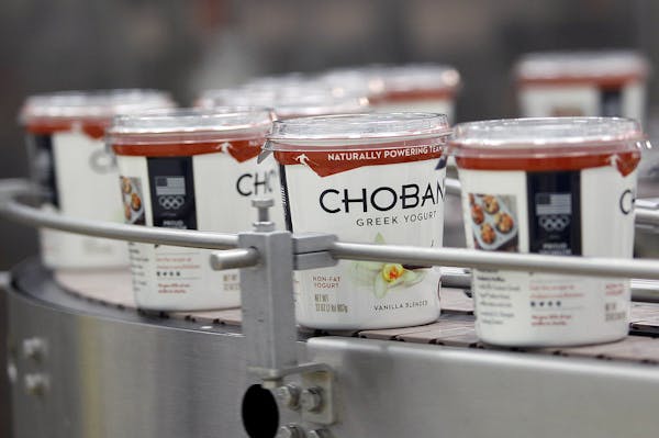 FILE - In this Jan. 21, 2014, file photo, yogurt containers run along a conveyer at the Chobani plant near Twin Falls, Idaho. Greek yogurt maker Choba