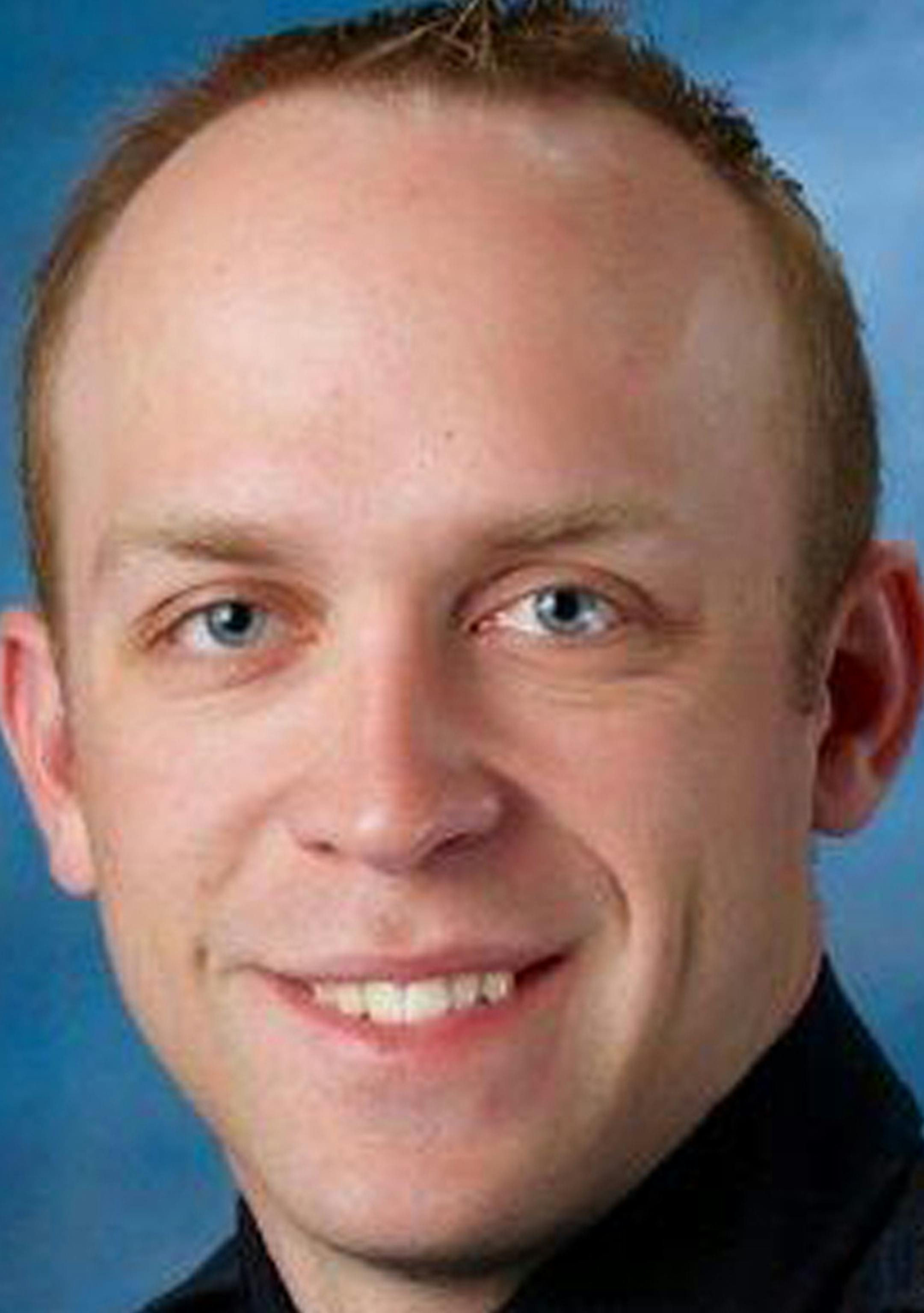 This undated photo released by Fargo Police Department shows Fargo police officer Jason Moszer. Moszer was shot amid a standoff in Fargo, N.D. with a domestic violence suspect, police in North Dakota said early Thursday, Feb. 10, 2016. Moszer, 33, responded to the standoff Wednesday night and parked near the home the suspect was barricaded inside, Fargo Deputy Police Chief Joe Anderson said. (Fargo Police Department via AP) MANDATORY CREDIT