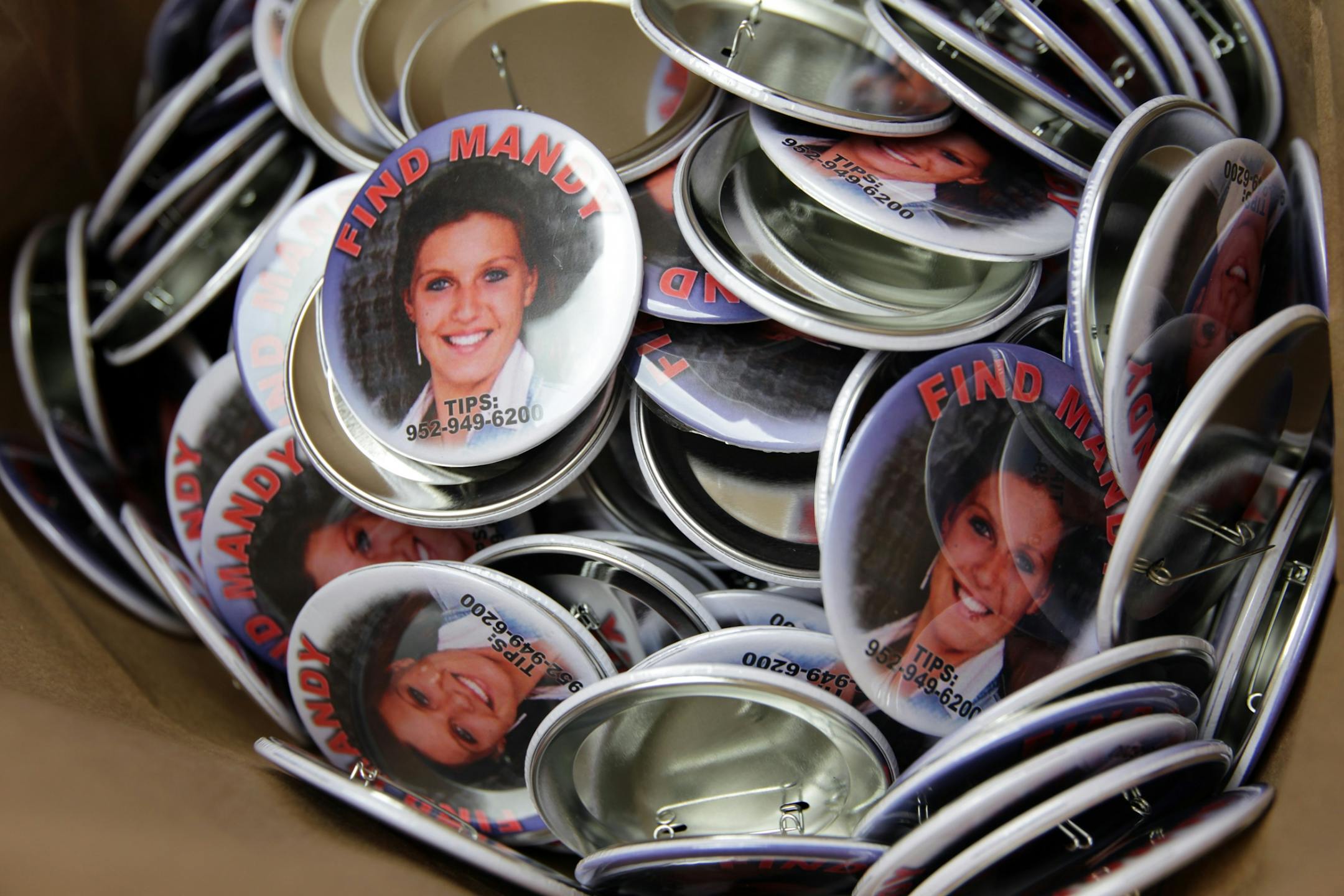Buttons were donated to the effort to find 24-year-old Mandy Matula in Victoria May 11, 2013.