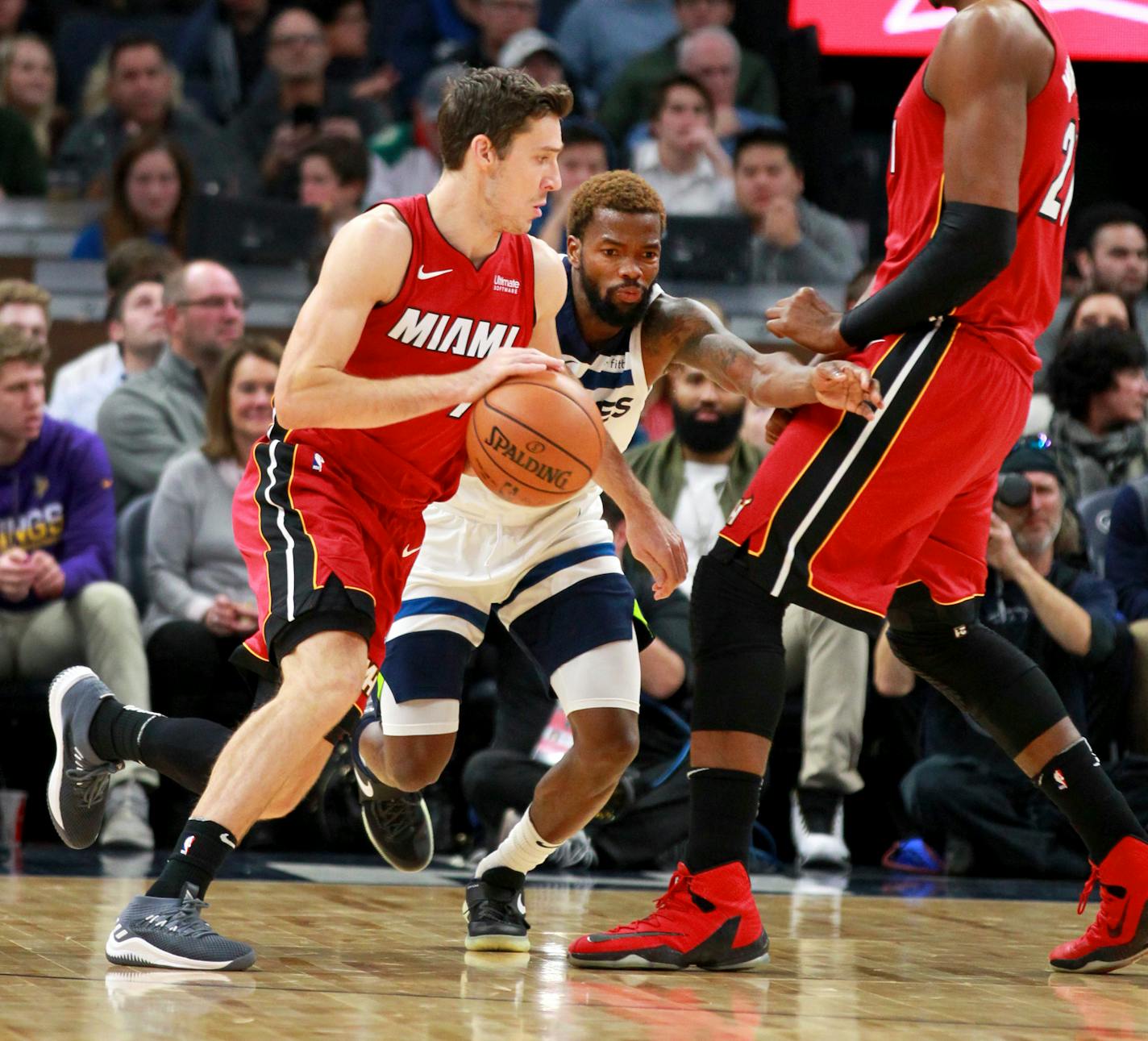 Miami Heat guard Goran Dragic (7) drives around a screen by Heat center Hassan Whiteside (21) with defense from Minnesota Timberwolves guard Aaron Brooks (30) in the first quarter of an NBA basketball game on Friday, Nov. 24, 2017, in Minneapolis. (AP Photo/Andy Clayton-King)