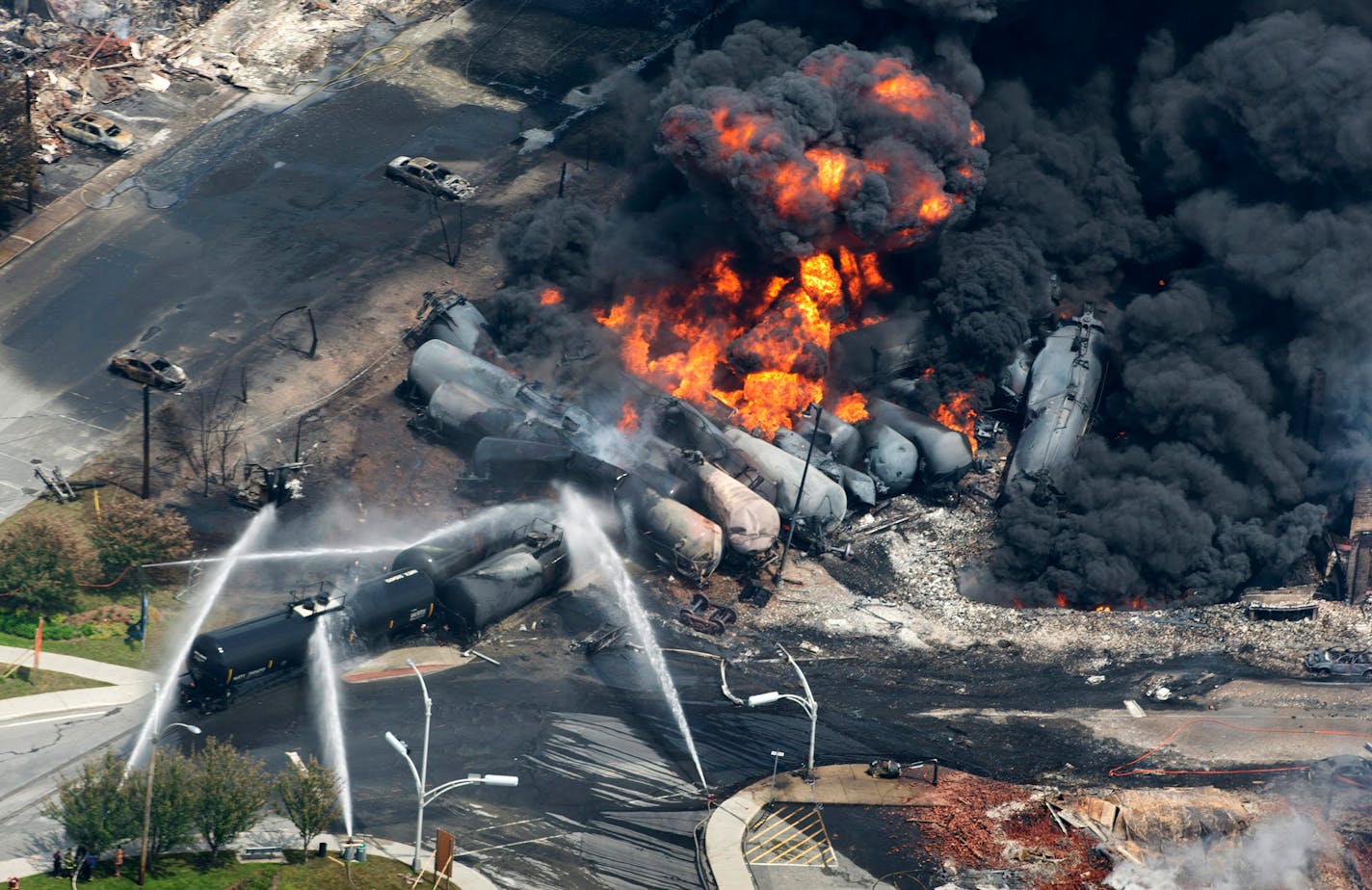 Smoke rose from railway cars that were carrying Bakken crude oil after derailing in downtown Lac Megantic, Quebec, in 2013, destroying much of the downtown and killing 47.