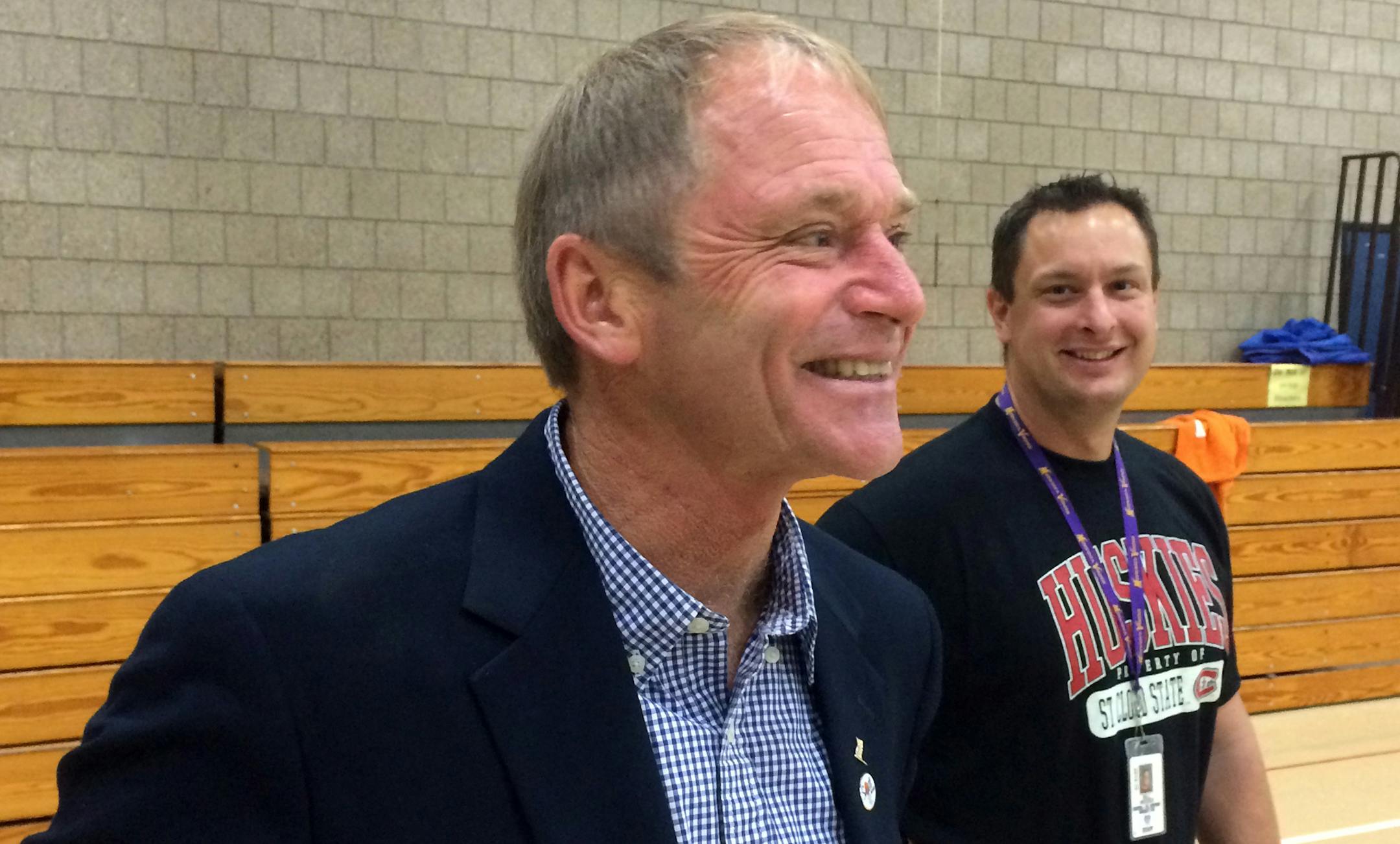 Joe Perske visits his colleagues at Sartell Middle School, where he taught physical education for 25 years before leaving this year to run for Congress. In the background is Bill Weiser. ] Photo: Patrick Coolican - Star Tribune Sartell, MN ORG XMIT: MIN1410301338329359