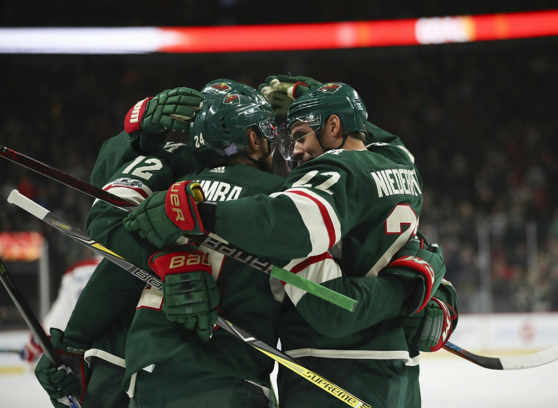 Minnesota Wild defenseman Matt Dumba (24) celebrated his first period goal with his linemates.