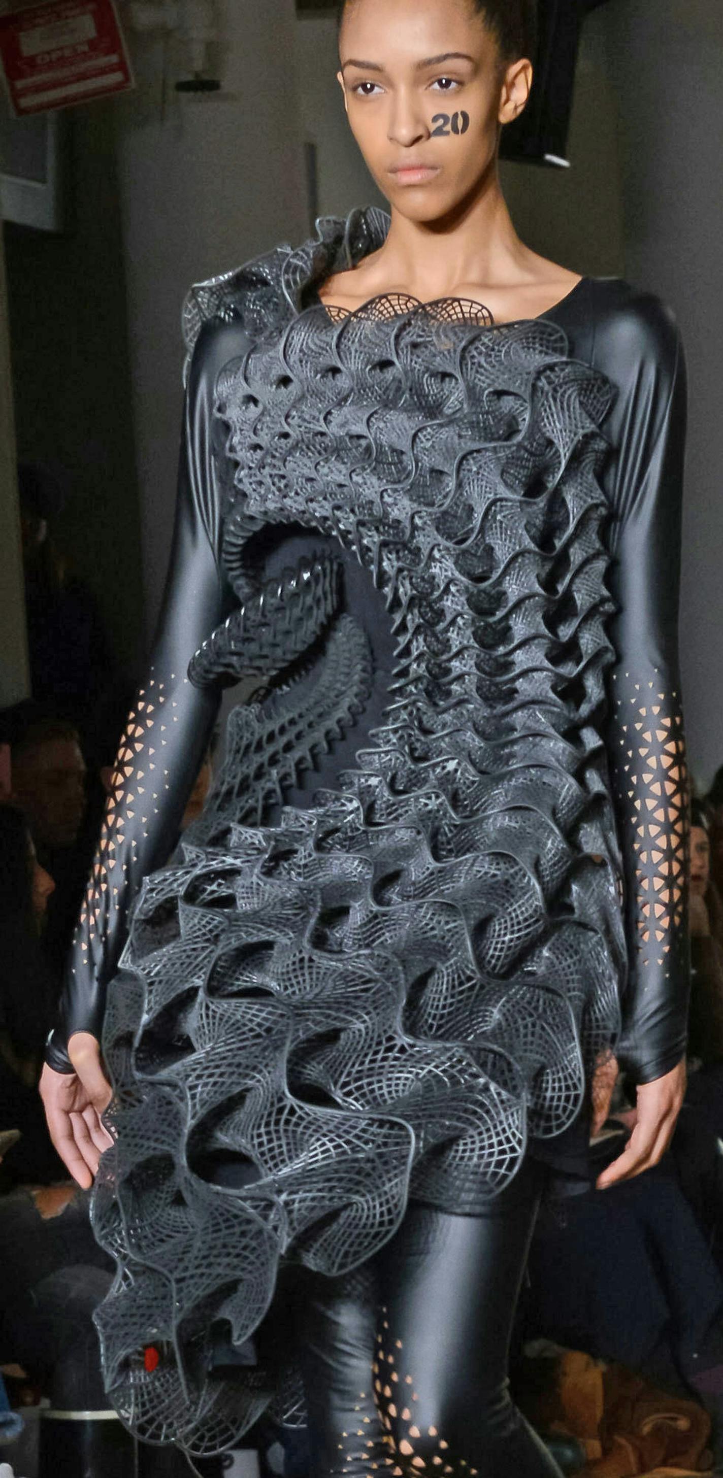 Two new 3-D printed dresses, named &#xeb;Pangolin&#xed; and &#xeb;Harmonograph&#xed; feature unique webbing, interlocking and chainmail like 3-D printed &#xec;fabric&#xee; that is designed to be hard in some areas and soft in others and very fluid and flexible.