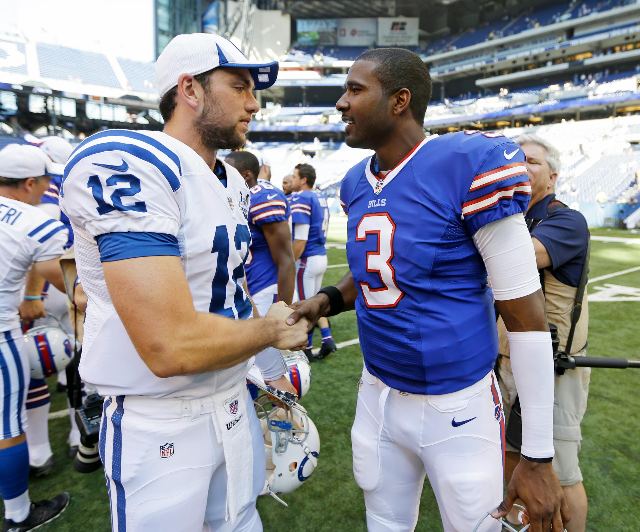 Colts second-year quarterback Andrew Luck, left, greeted Bills rookie QB EJ Manuel following Buffalo's 44-20 preseason victory on Sunday.