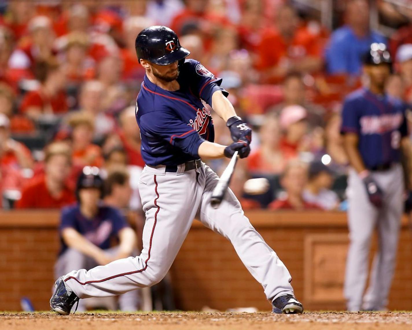 Minnesota Twins' Shane Robinson hits for a single during the sixth inning of a baseball game against the St. Louis Cardinals Monday, June 15, 2015, in St. Louis.